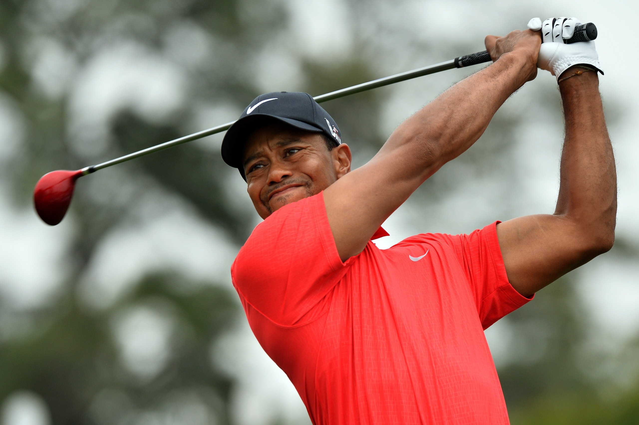 Tigers Woods of the US hits a shot during the final round of the 77th Masters golf tournament at Augusta National Golf Club on April 14, 2013 in Augusta, Georgia.  AFP PHOTO / JEWEL SAMAD        (Photo credit should read JEWEL SAMAD/AFP/Getty Images)