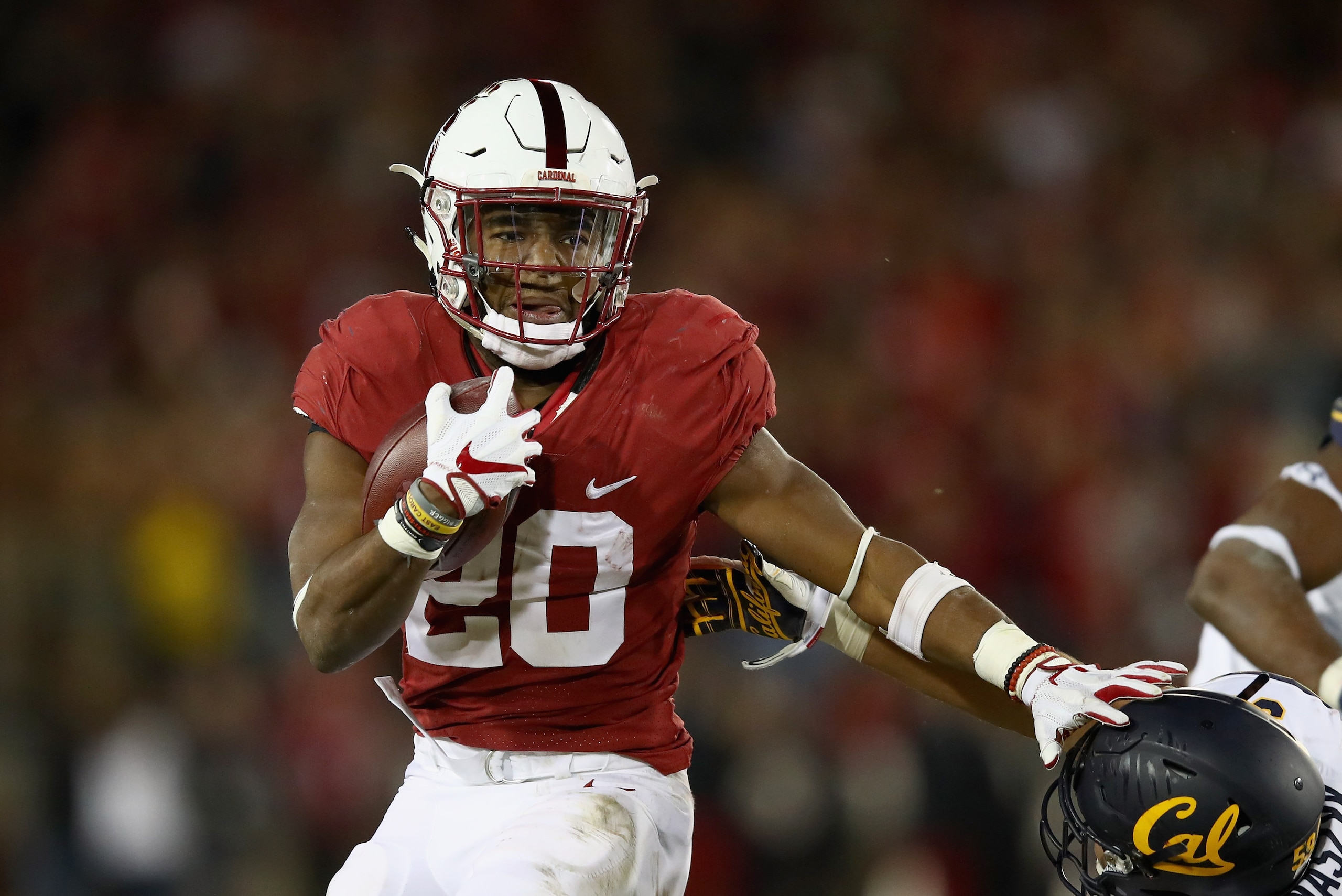 PALO ALTO, CA - NOVEMBER 18:  Bryce Love #20 of the Stanford Cardinal in action against the California Golden Bears at Stanford Stadium on November 18, 2017 in Palo Alto, California.  (Photo by Ezra Shaw/Getty Images)