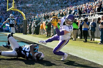 CHARLOTTE, NC - DECEMBER 10:  Adam Thielen #19 of the Minnesota Vikings attempts a pass catch against Kevon Seymour #27 of the Carolina Panthers in the second quarter during their game at Bank of America Stadium on December 10, 2017 in Charlotte, North Ca