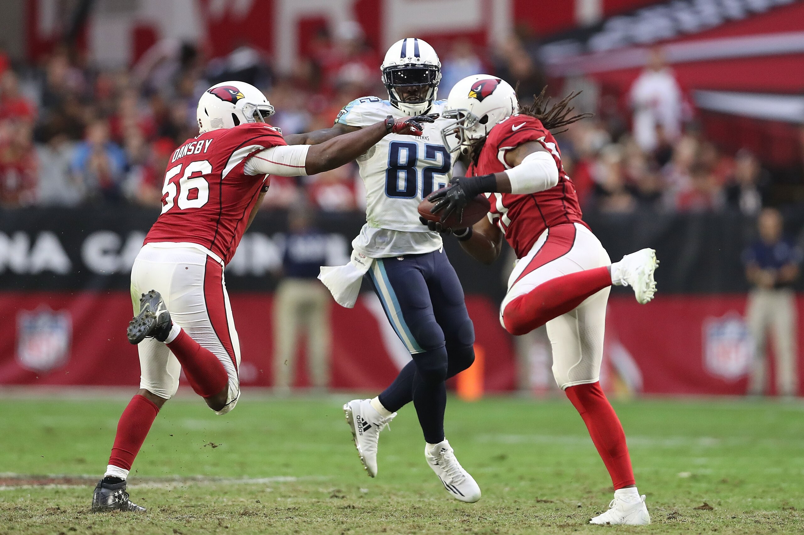GLENDALE, AZ - DECEMBER 10: Delanie Walker #82 of the Tennessee Titans watches as Josh Bynes #57 of the Arizona Cardinals makes an interception in the second half at University of Phoenix Stadium on December 10, 2017 in Glendale, Arizona. (Photo by Chri GLENDALE, AZ - DECEMBER 10: Delanie Walker #82 of the Tennessee Titans watches as Josh Bynes #57 of the Arizona Cardinals makes an interception in the second half at University of Phoenix Stadium on December 10, 2017 in Glendale, Arizona. (Photo by Chri