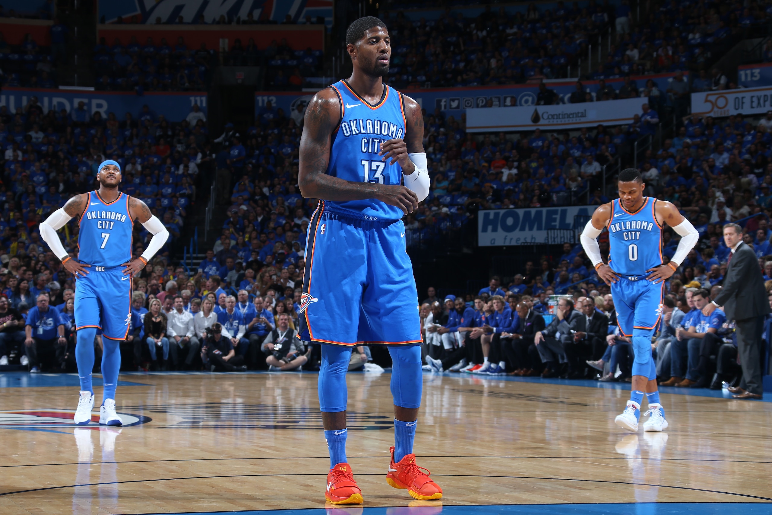 OKLAHOMA CITY, OK- OCTOBER 19: Paul George #13 shoots a foul shot while Carmelo Anthony #7 and Russell Westbrook #0 of the Oklahoma City Thunder look during the game against the New York Knicks on October 19, 2017 at Chesapeake Energy Arena in Oklahoma C OKLAHOMA CITY, OK- OCTOBER 19: Paul George #13 shoots a foul shot while Carmelo Anthony #7 and Russell Westbrook #0 of the Oklahoma City Thunder look during the game against the New York Knicks on October 19, 2017 at Chesapeake Energy Arena in Oklahoma C