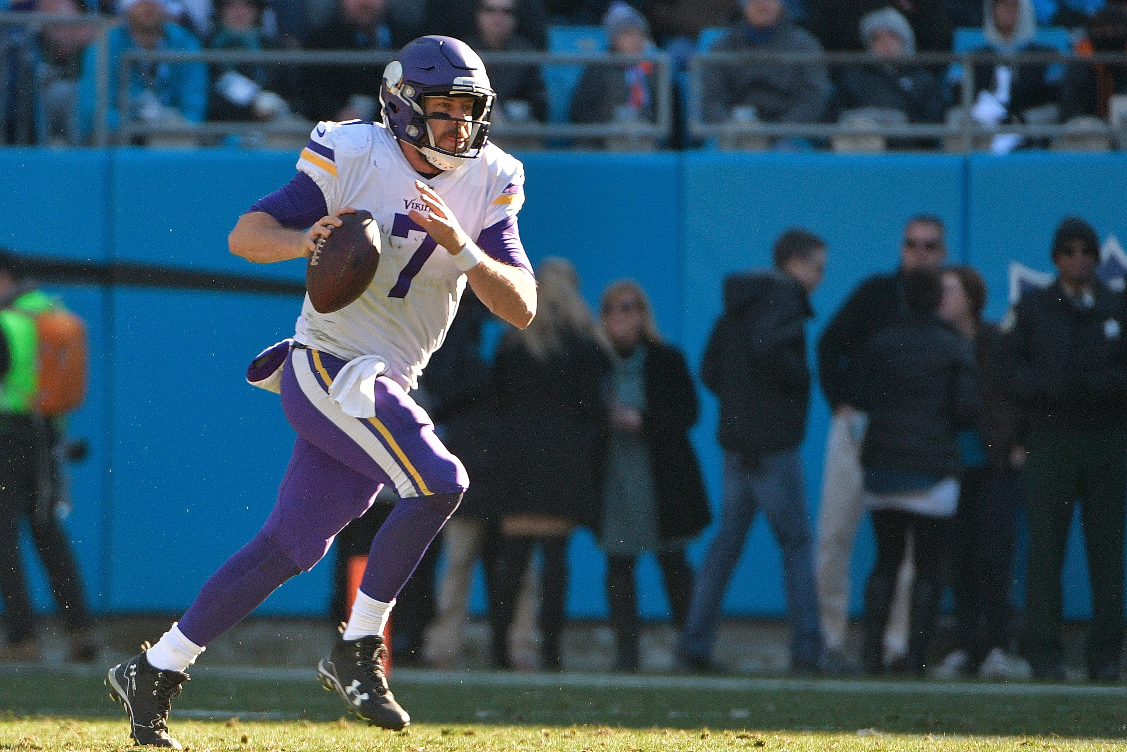 CHARLOTTE, NC - DECEMBER 10:  Case Keenum #7 of the Minnesota Vikings rolls out against the Carolina Panthers during their game at Bank of America Stadium on December 10, 2017 in Charlotte, North Carolina.  (Photo by Grant Halverson/Getty Images)