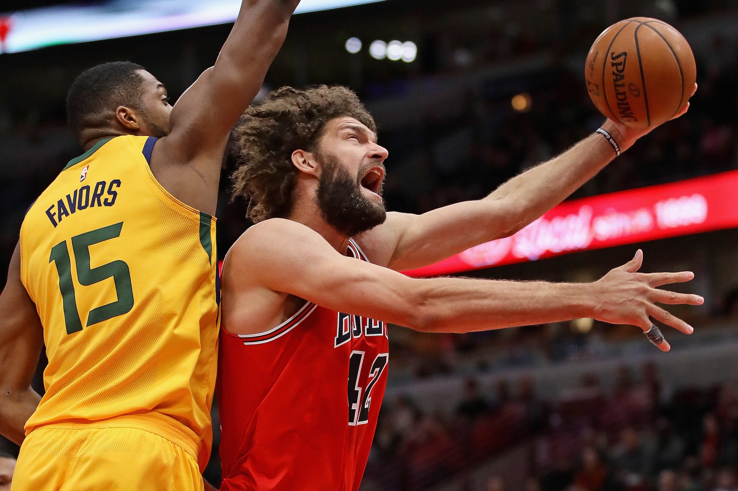 CHICAGO, IL - DECEMBER 13: Robin Lopez #42 of the Chicago Bulls puts up a shot past Derrick Favors #15 of the Utah Jazz at the United Center on December 13, 2017 in Chicago, Illinois. NOTE TO USER: User expressly acknowledges and agrees that, by download CHICAGO, IL - DECEMBER 13: Robin Lopez #42 of the Chicago Bulls puts up a shot past Derrick Favors #15 of the Utah Jazz at the United Center on December 13, 2017 in Chicago, Illinois. NOTE TO USER: User expressly acknowledges and agrees that, by download