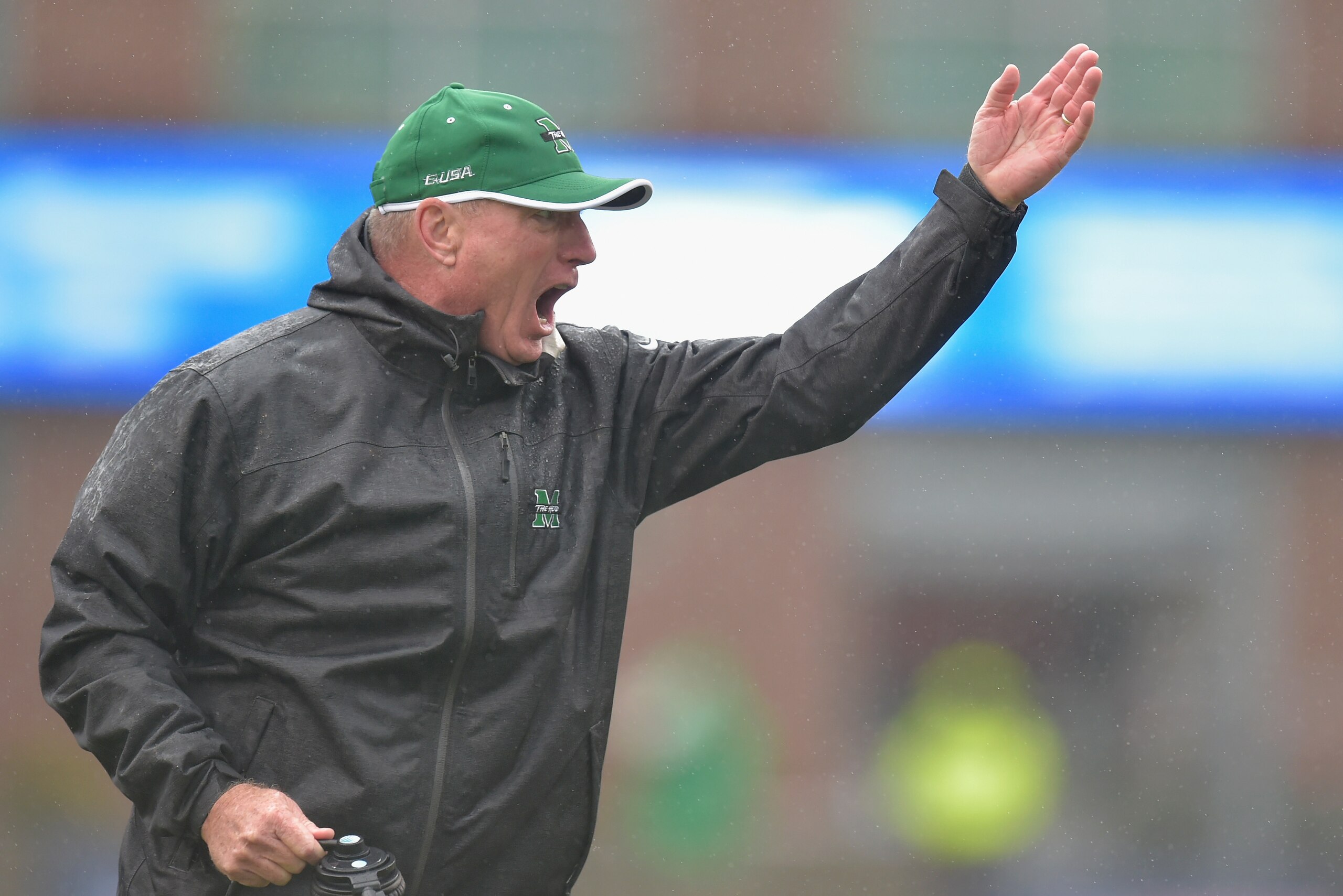 HUNTINGTON, WV - DECEMBER 06:  Marshall Head Coach Doc Holliday directs his team during the first quarter against the Louisiana Tech Bulldogs at Joan C. Edwards Stadium during the Conference USA championship game on December 6, 2014 in Huntington, West Vi
