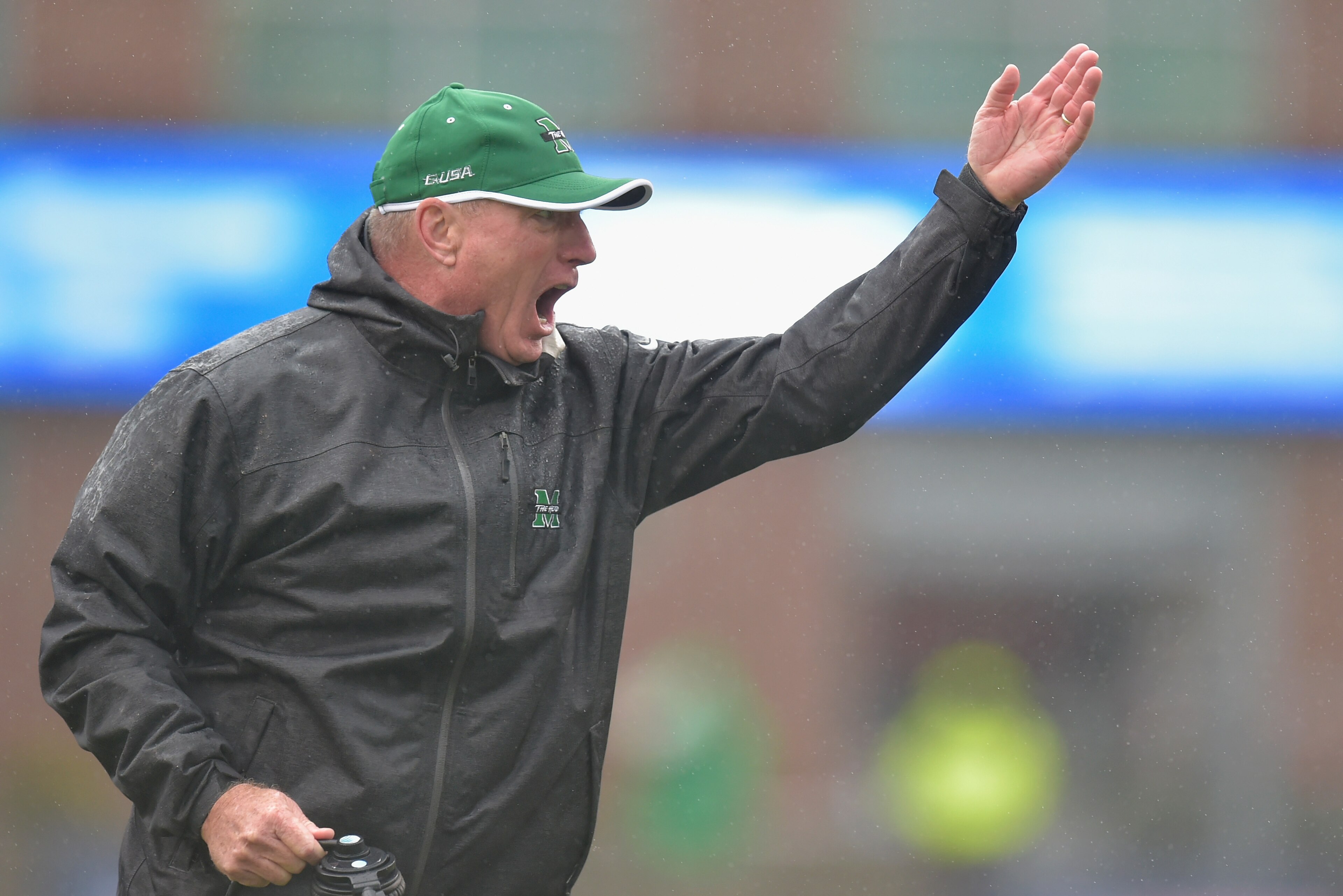 HUNTINGTON, WV - DECEMBER 06:  Marshall Head Coach Doc Holliday directs his team during the first quarter against the Louisiana Tech Bulldogs at Joan C. Edwards Stadium during the Conference USA championship game on December 6, 2014 in Huntington, West Vi