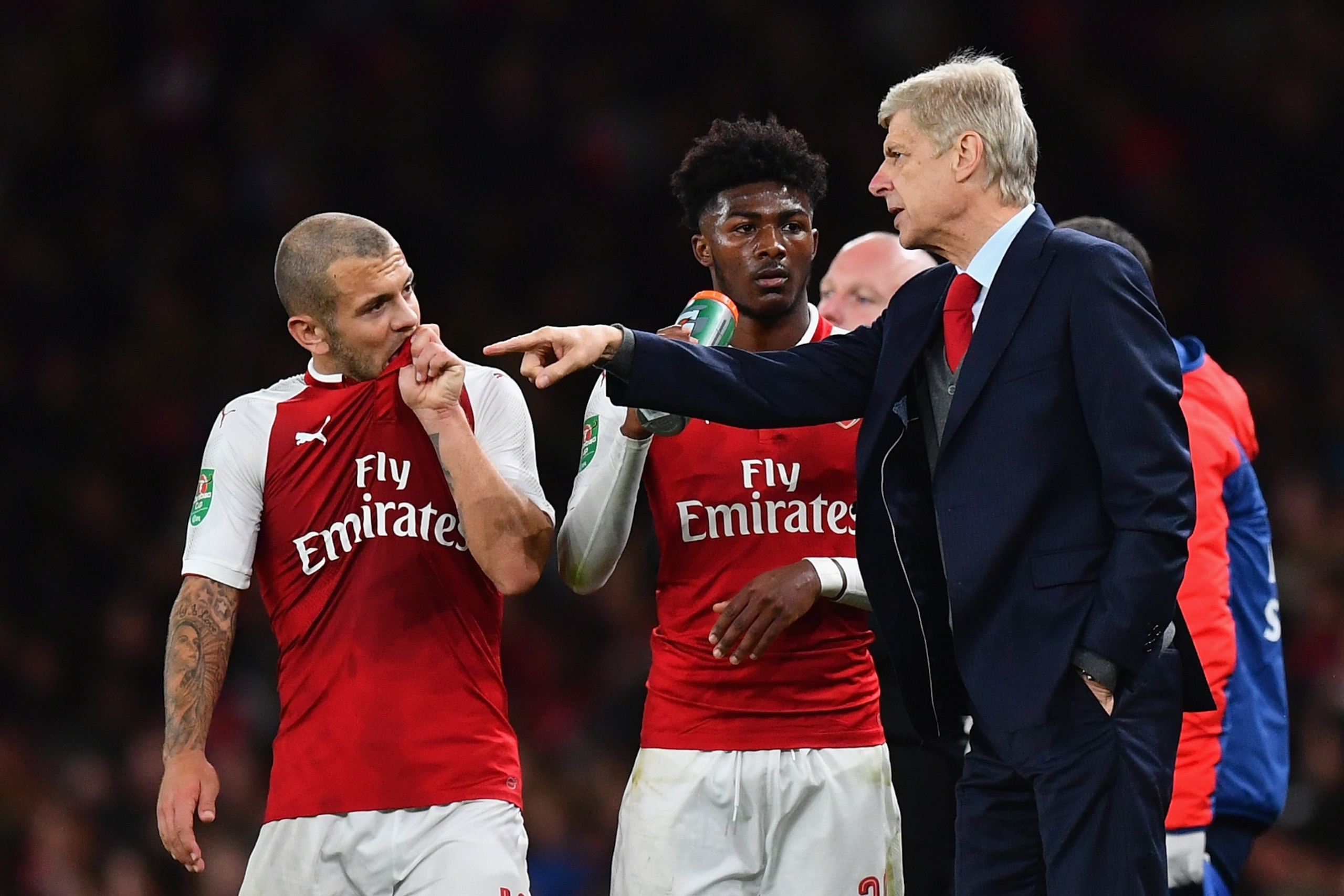 LONDON, ENGLAND - SEPTEMBER 20: Arsene Wenger, Manager of Arsenal speaks to Jack Wilshere of Arsenal during the Carabao Cup Third Round match between Arsenal and Doncaster Rovers at Emirates Stadium on September 20, 2017 in London, England.  (Photo by Dan