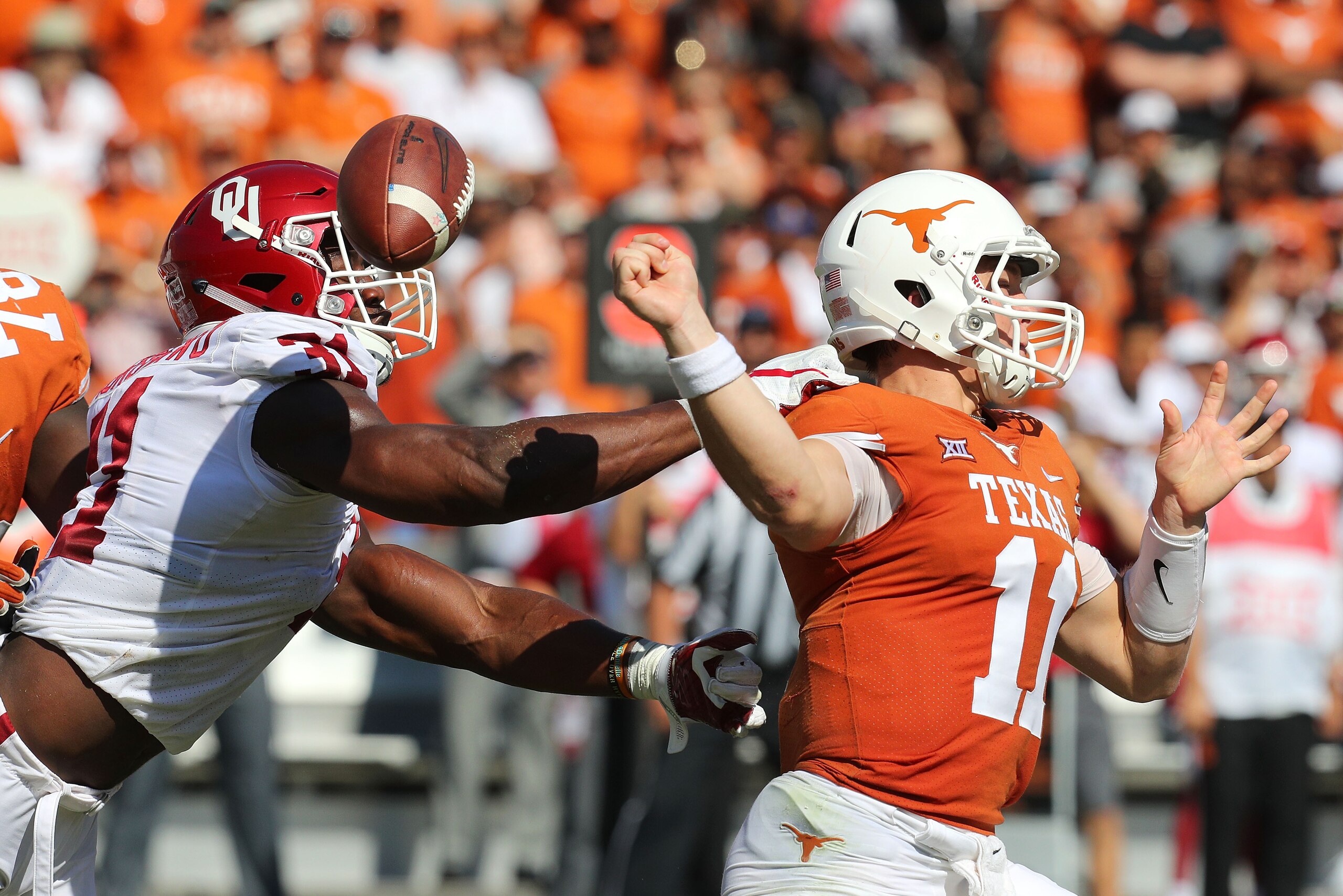 DALLAS, TX - OCTOBER 14:  Ogbonnia Okoronkwo #31 of the Oklahoma Sooners forces a fumble by Sam Ehlinger #11 of the Texas Longhorns in the first quarter  at Cotton Bowl on October 14, 2017 in Dallas, Texas.  (Photo by Richard W. Rodriguez/Getty Images)