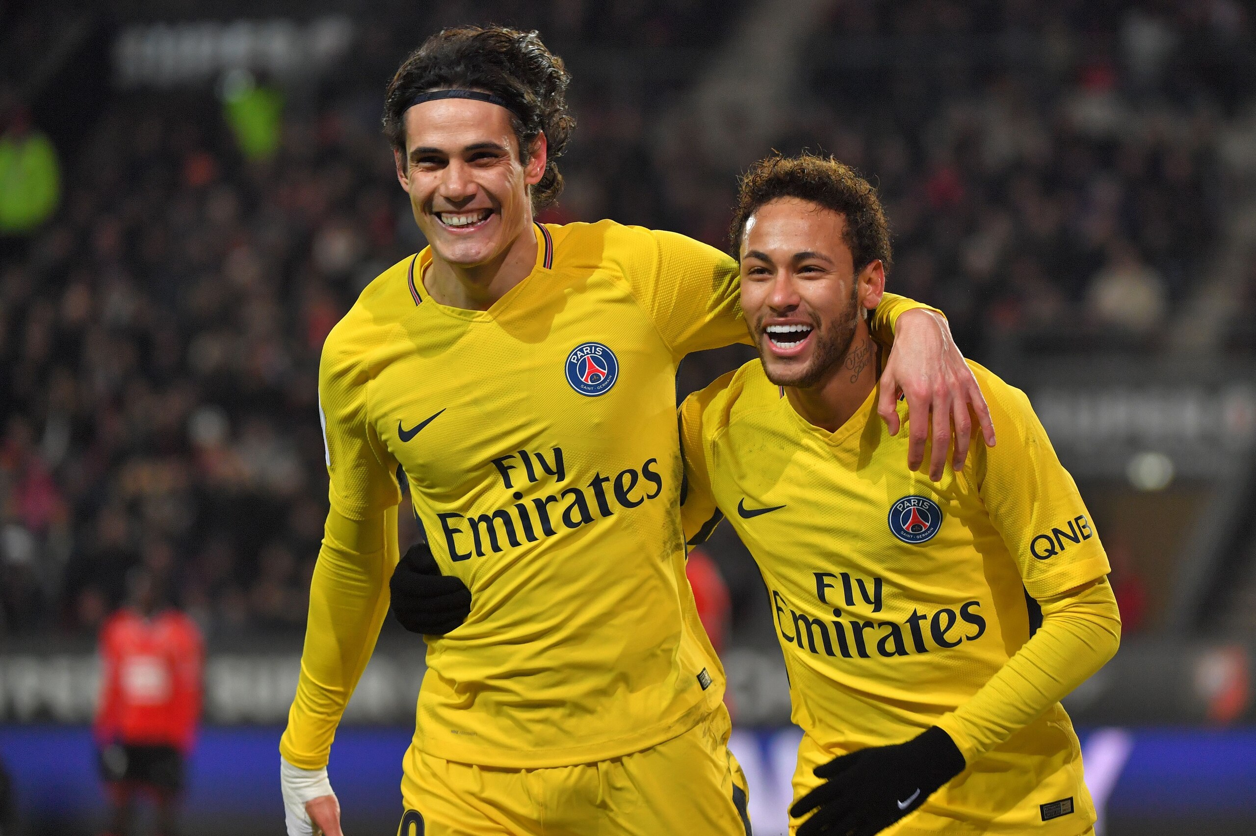 Paris Saint-Germain's Brazilian forward Neymar (R) celebrates after scoring with Paris Saint-Germain's Uruguayan forward Edinson Cavani during the French L1 football match between Rennes (Stade Rennais FC) and Paris Saint Germain (PSG), on December 16, 20 Paris Saint-Germain's Brazilian forward Neymar (R) celebrates after scoring with Paris Saint-Germain's Uruguayan forward Edinson Cavani during the French L1 football match between Rennes (Stade Rennais FC) and Paris Saint Germain (PSG), on December 16, 20