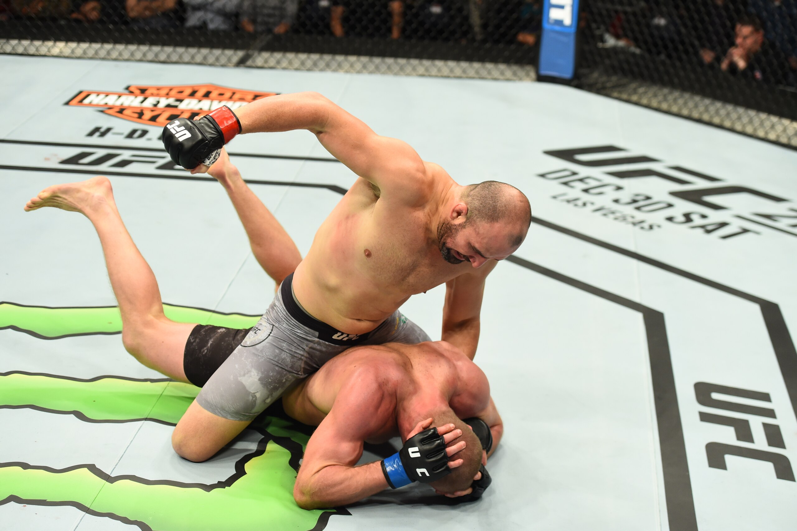 WINNIPEG, CANADA - DECEMBER 16:  Glover Teixeira of Brazil (top) punches Misha Cirkunov of Latvia in their light heavyweight bout during the UFC Fight Night event at Bell MTS Place on December 16, 2017 in Winnipeg, Manitoba, Canada. (Photo by Josh Hedges/