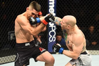 WINNIPEG, CANADA - DECEMBER 16:  (R-L) Josh Emmett punches Ricardo Lamas in their featherweight bout during the UFC Fight Night event at Bell MTS Place on December 16, 2017 in Winnipeg, Manitoba, Canada. (Photo by Josh Hedges/Zuffa LLC/Zuffa LLC via Getty