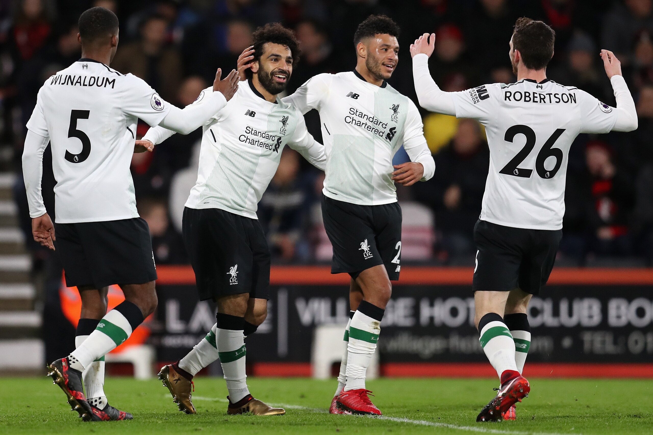 BOURNEMOUTH, ENGLAND - DECEMBER 17:  Mohamed Salah of Liverpool celebrates with teammates Georginio Wijnaldum, Alex Oxlade-Chamberlain, and Andy Robertson after scoring his sides third goal  during the Premier League match between AFC Bournemouth and Live