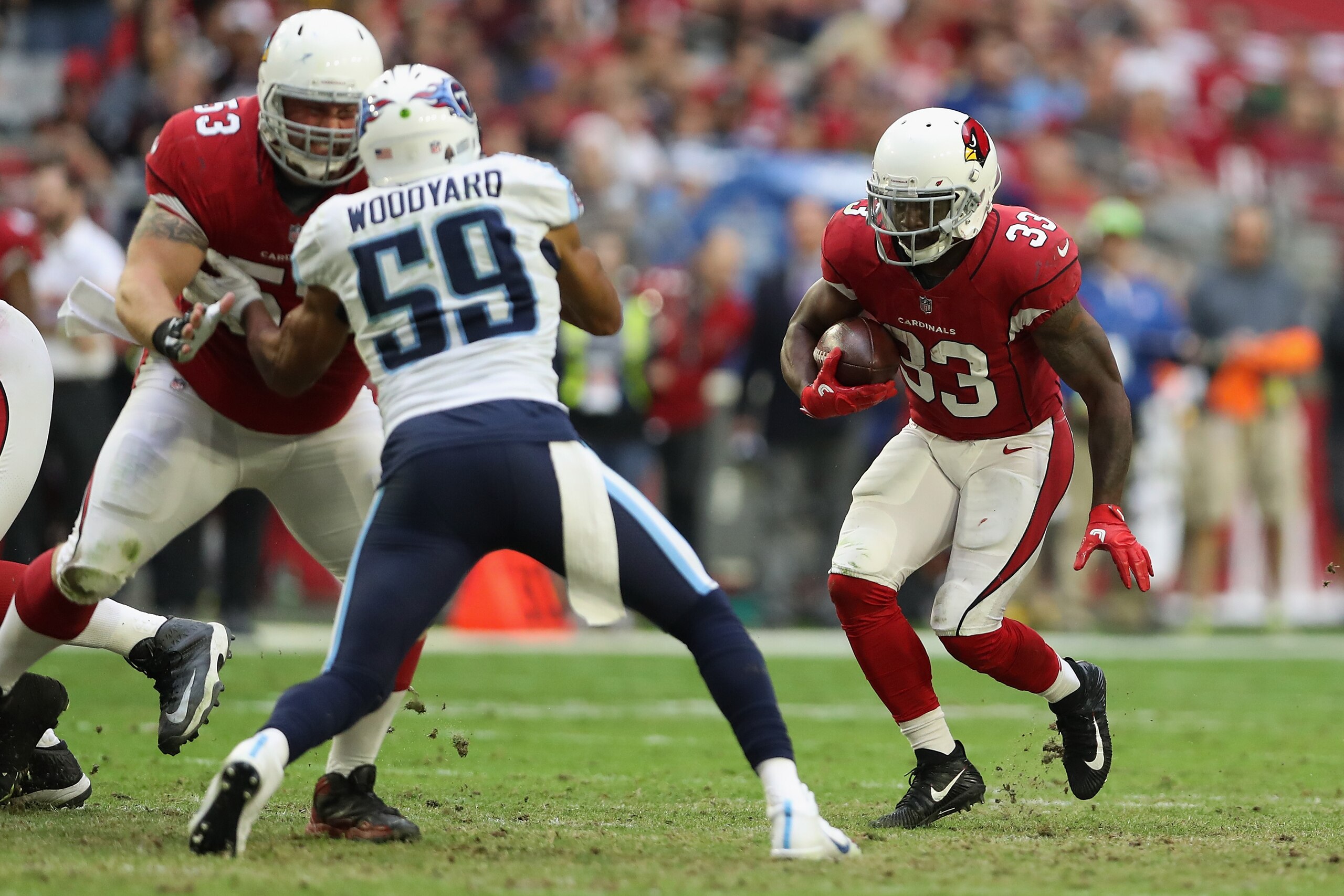GLENDALE, AZ - DECEMBER 10:  Running back Kerwynn Williams #33 of the Arizona Cardinals rushes the football against the Tennessee Titans during the NFL game at the University of Phoenix Stadium on December 10, 2017 in Glendale, Arizona.  The Cardinals def
