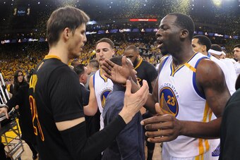 OAKLAND, CA - JUNE 12: Kyle Korver #26 of the Cleveland Cavaliers gives five to Draymond Green #23 of the Golden State Warriors after Game Five of the 2017 NBA Finals on June 12, 2017 at Oracle Arena in Oakland, California. NOTE TO USER: User expressly ac
