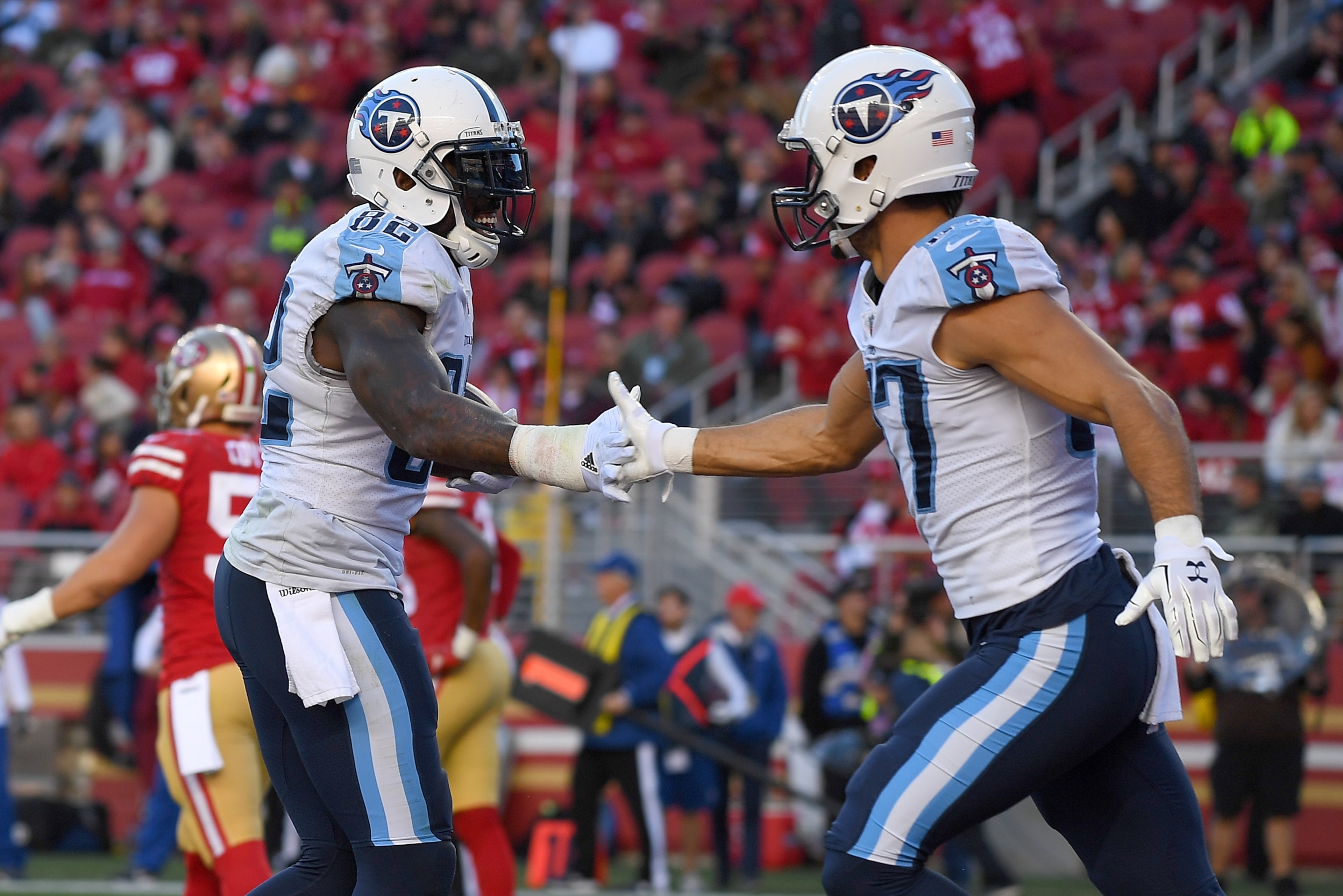 SANTA CLARA, CA - DECEMBER 17:  Delanie Walker #82 and Eric Decker #87 of the Tennessee Titans celebrate after Walker caught a touchdown pass against the San Francisco 49ers during their NFL football game at Levi's Stadium on December 17, 2017 in Santa Cl