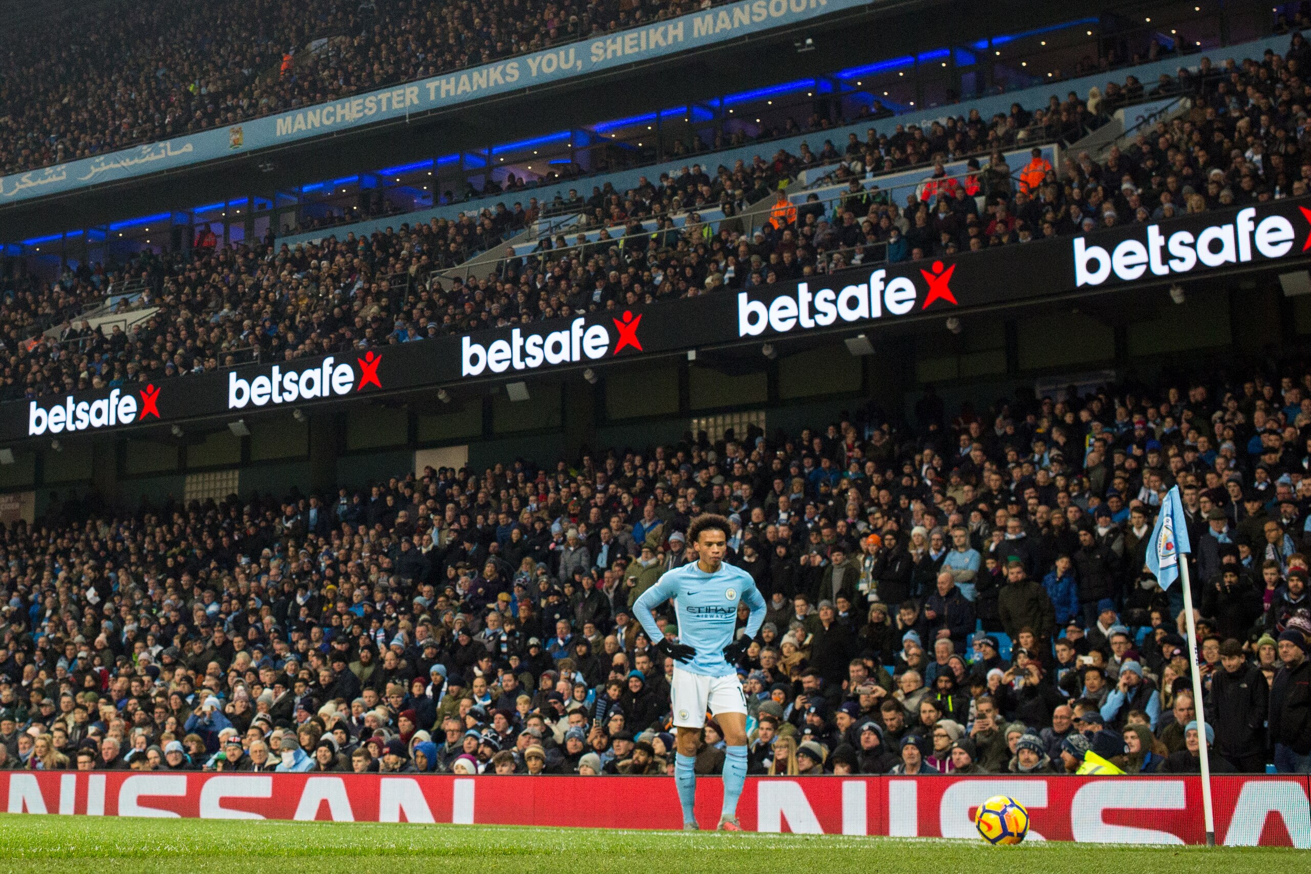 MANCHESTER, ENGLAND - DECEMBER 16: Leroy Sane of Manchester City takes a comer during the Premier League match between Manchester City and Tottenham Hotspur at Etihad Stadium on December 16, 2017 in Manchester, England. (Photo by Robbie Jay Barratt - AMA/