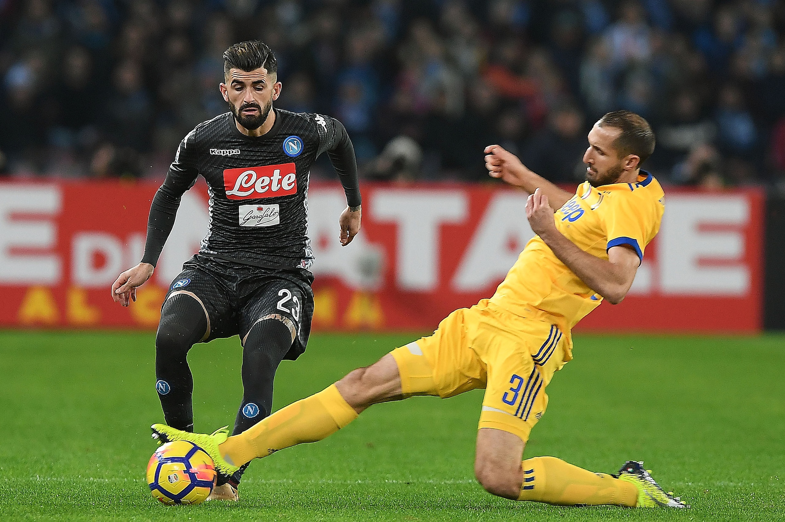NAPLES, ITALY - DECEMBER 01: Player of SSC Napoli Elseid Hysaj vies with Juventus player Giorgio Chiellini during the Serie A match between SSC Napoli and Juventus at Stadio San Paolo on December 1, 2017 in Naples, Italy.  (Photo by Francesco Pecoraro/Get