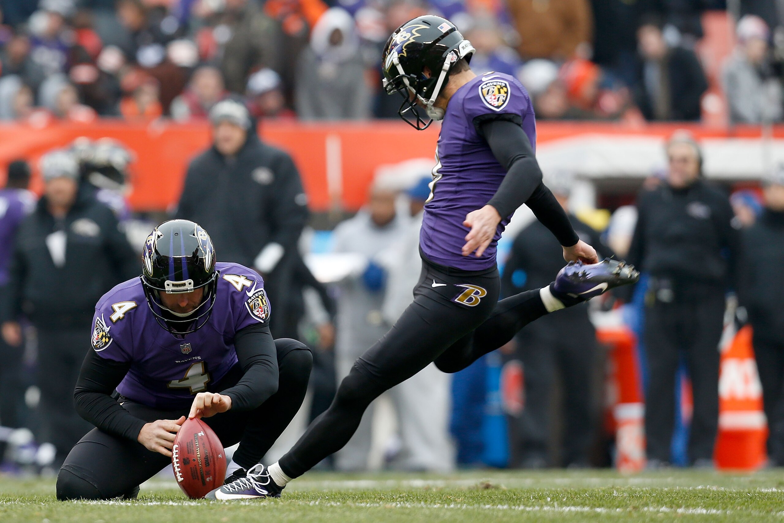 CLEVELAND, OH - DECEMBER 17:  Sam Koch #4 of the Baltimore Ravens holds the ball as Justin Tucker #9 of the Baltimore Ravens kicks a field goal during the game against the Cleveland Browns at FirstEnergy Stadium on December 17, 2017 in Cleveland, Ohio. Ba