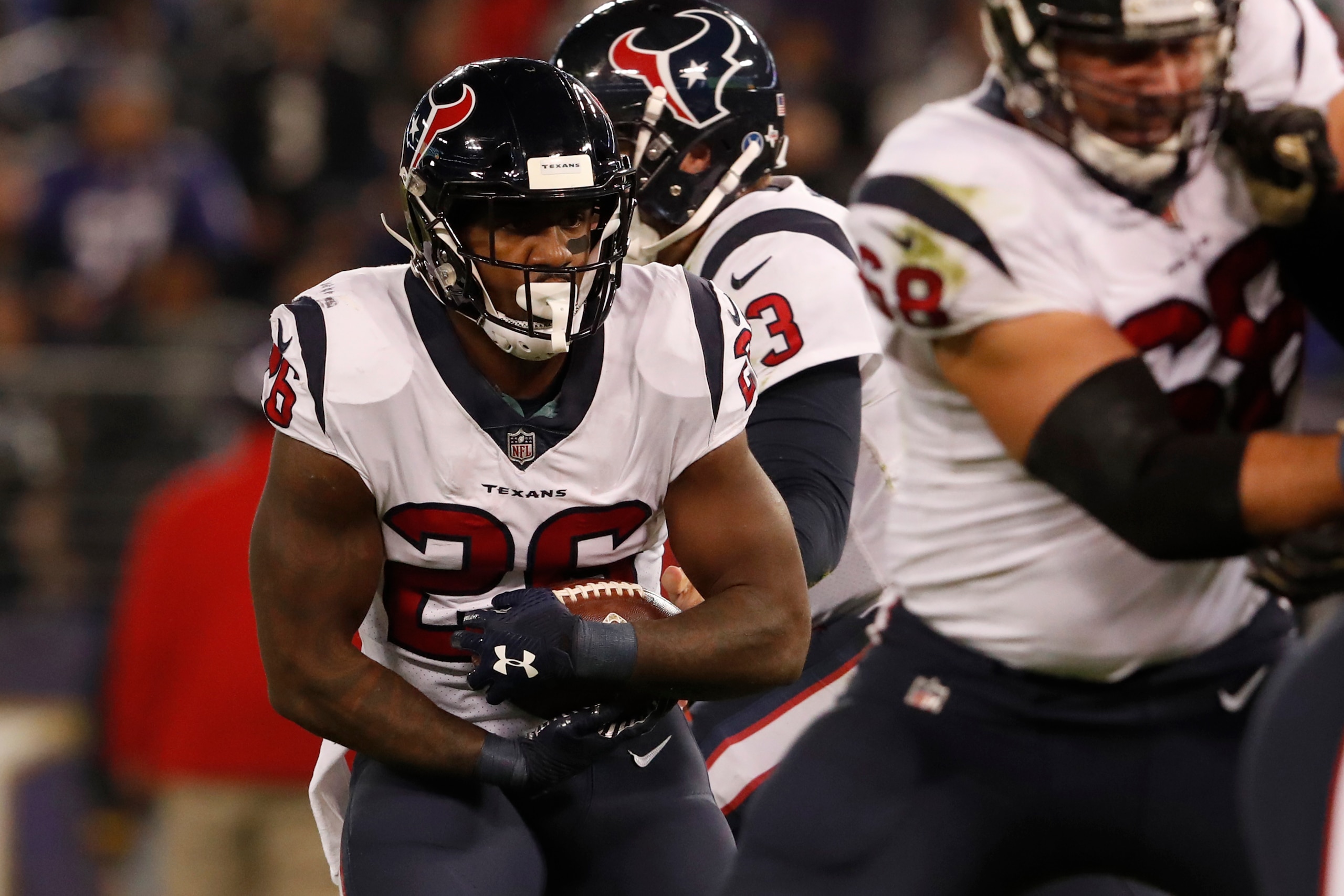 BALTIMORE, MD - NOVEMBER 27: Running Back Lamar Miller #26 of the Houston Texans carries the ball in the first quarter against the Baltimore Ravens at M&T Bank Stadium on November 27, 2017 in Baltimore, Maryland. (Photo by Todd Olszewski/Getty Images)