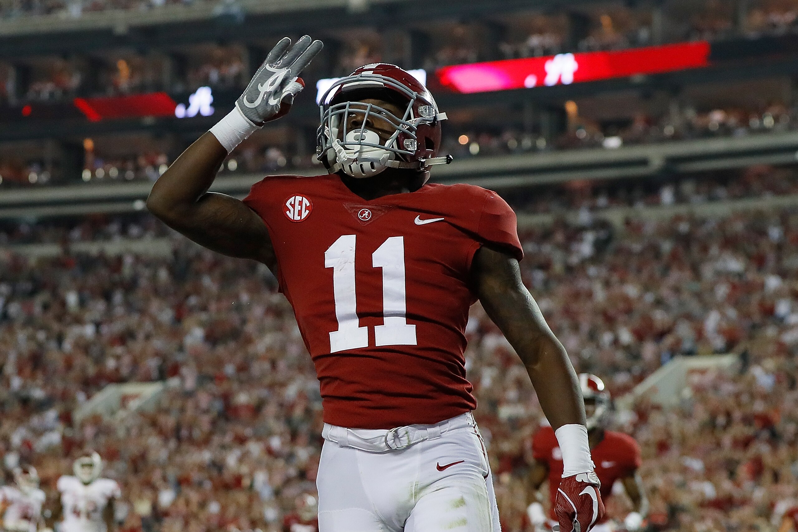 TUSCALOOSA, AL - OCTOBER 14:  Henry Ruggs III #11 of the Alabama Crimson Tide reacts after pulling in a touchdown reception against the Arkansas Razorbacks at Bryant-Denny Stadium on October 14, 2017 in Tuscaloosa, Alabama.  (Photo by Kevin C. Cox/Getty I