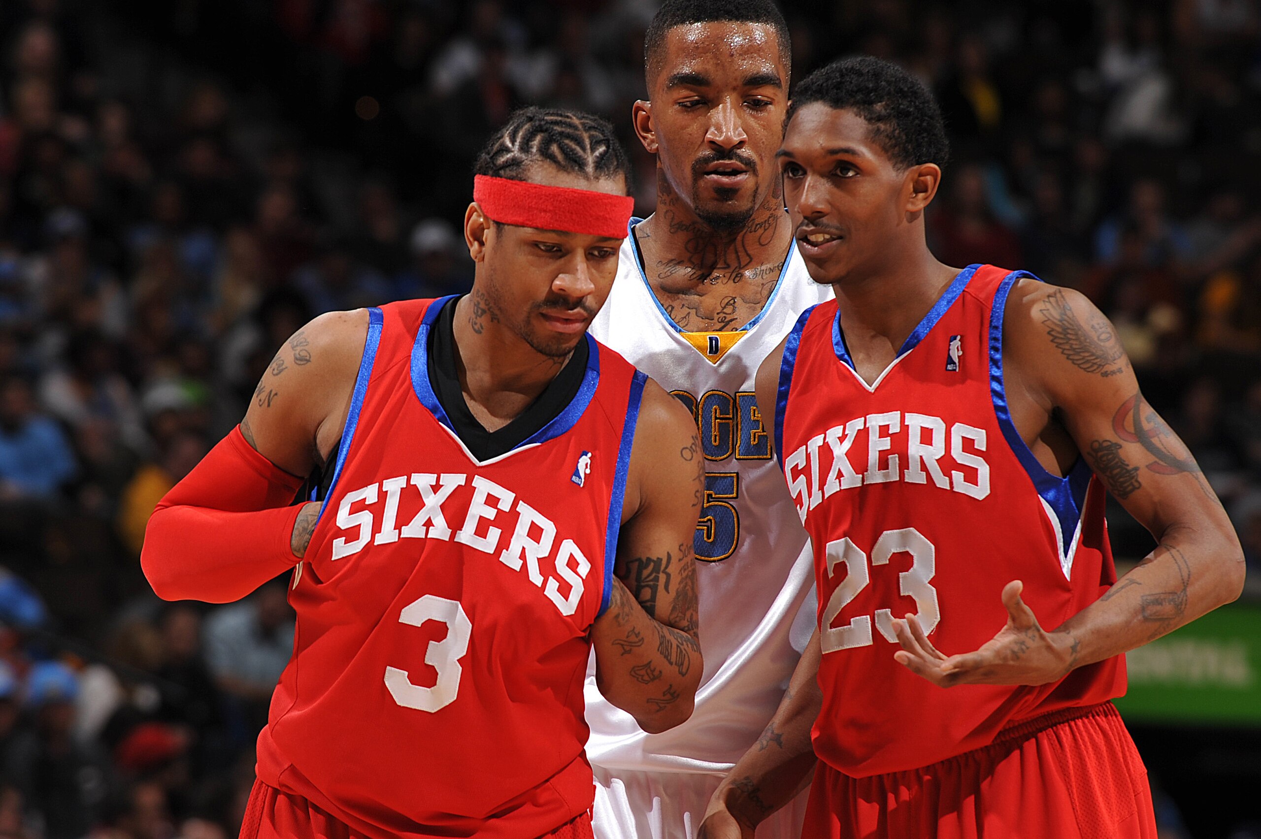 DENVER - JANUARY 3: Allen Iverson #3 and Louis Williams #23 of the Philadelphia 76ers talk while J.R. Smith #5 of the Denver Nuggets listens in on January 3, 2010 at the Pepsi Center in Denver, Colorado. NOTE TO USER: User expressly acknowledges and agree