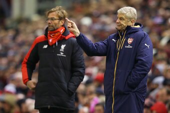 LIVERPOOL, ENGLAND - JANUARY 13:  Jurgen Klopp, manager of Liverpool and Arsene Wenger Manager of Arsenal look on during the Barclays Premier League match between Liverpool and Arsenal at Anfield on January 13, 2016 in Liverpool, England.  (Photo by Alex 