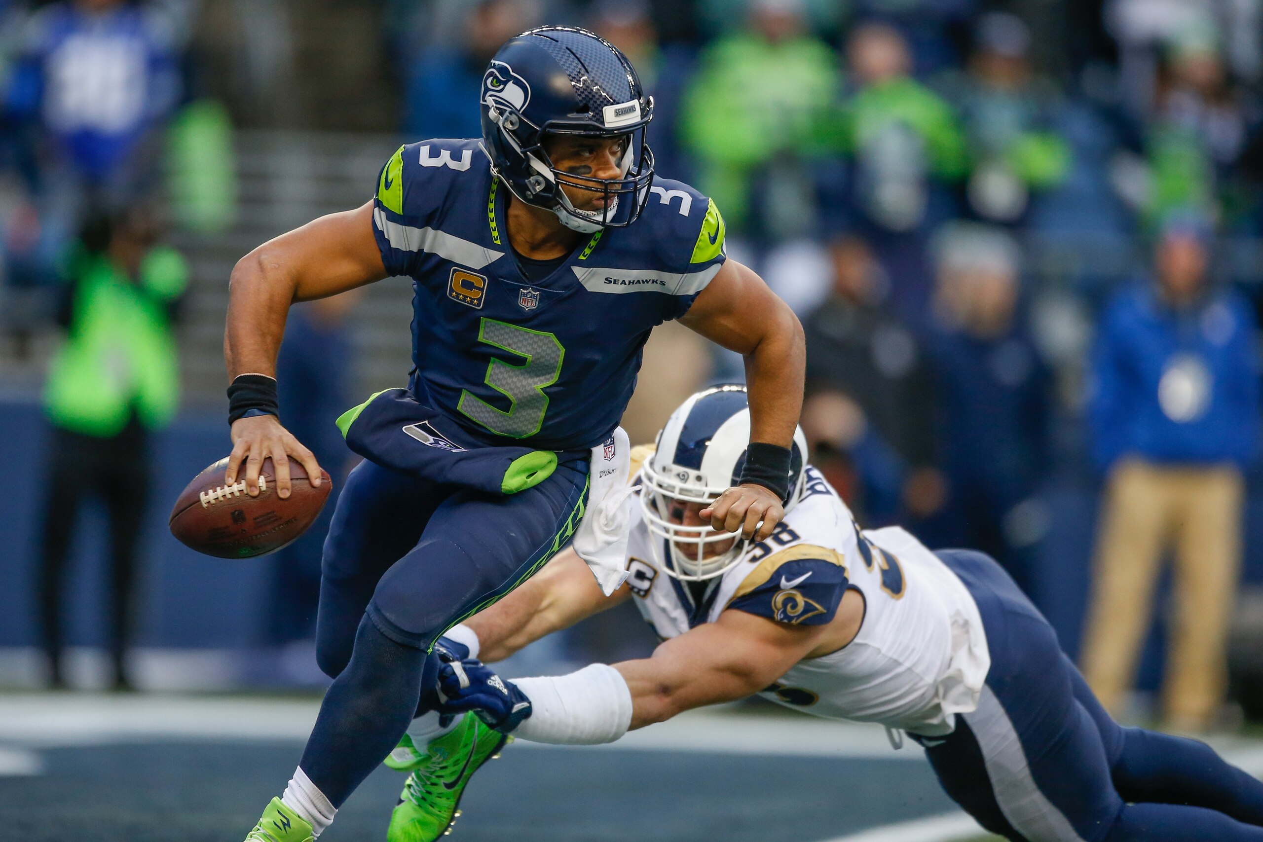 SEATTLE, WA - DECEMBER 17: Quarterback Russell Wilson #3 of the Seattle Seahawks rushes against linebacker Connor Barwin #98 of the Los Angeles Rams at CenturyLink Field on December 17, 2017 in Seattle, Washington. (Photo by Otto Greule Jr/Getty Images) SEATTLE, WA - DECEMBER 17: Quarterback Russell Wilson #3 of the Seattle Seahawks rushes against linebacker Connor Barwin #98 of the Los Angeles Rams at CenturyLink Field on December 17, 2017 in Seattle, Washington. (Photo by Otto Greule Jr/Getty Images)