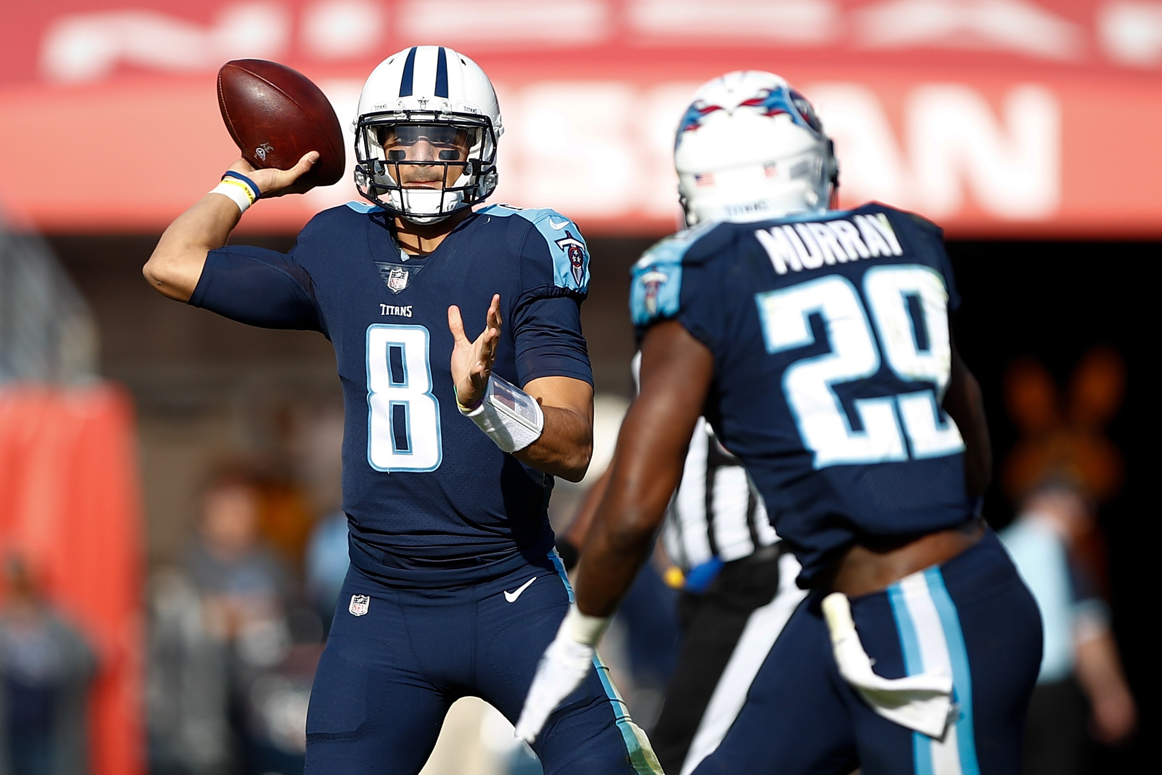 NASHVILLE, TN - DECEMBER 03:  Marcus Mariota #8 of the Tennessee Titans throws a pass to DeMarco Murray #29 against the Houston Texans during the first half at Nissan Stadium on December 3, 2017 in Nashville, Tennessee.  (Photo by Wesley Hitt/Getty Images