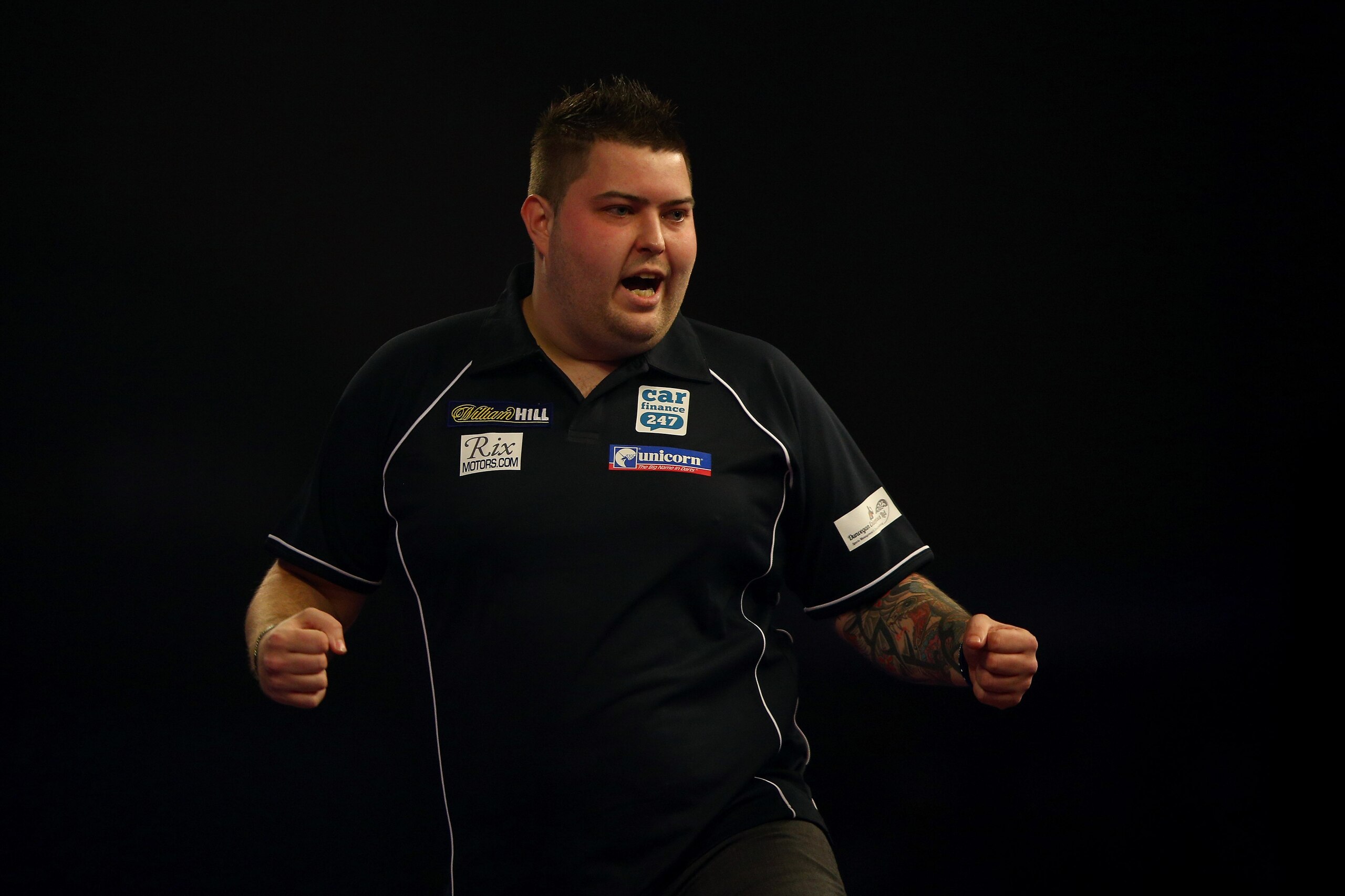 LONDON, ENGLAND - DECEMBER 21:  Michael Smith of England celebrates during his match against Jeffrey De Zwaan during the 2016 William Hill PDC World Darts Championships on Day Five at Alexandra Palace on December 21, 2015 in London, England.  (Photo by Ia