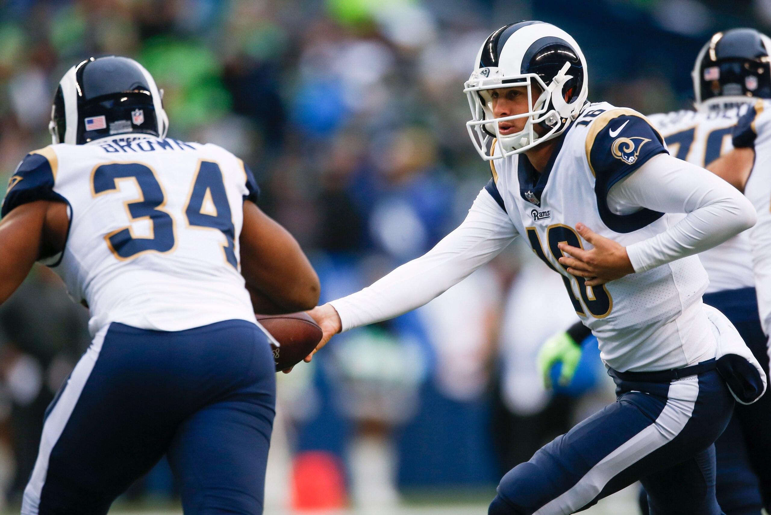 SEATTLE, WA - DECEMBER 17: Quarterback Jared Goff #16 of the Los Angeles Rams hands off to Malcolm Brown #34 during the third quarter of the game at CenturyLink Field on December 17, 2017 in Seattle, Washington. (Photo by Otto Greule Jr /Getty Images) SEATTLE, WA - DECEMBER 17: Quarterback Jared Goff #16 of the Los Angeles Rams hands off to Malcolm Brown #34 during the third quarter of the game at CenturyLink Field on December 17, 2017 in Seattle, Washington. (Photo by Otto Greule Jr /Getty Images)