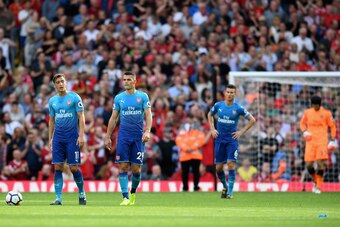 LIVERPOOL, ENGLAND - AUGUST 27:  Mesut Ozil of Arsenal are Granit Xhaka of Arsenal are dejected after Liverpool's fourth goal during the Premier League match between Liverpool and Arsenal at Anfield on August 27, 2017 in Liverpool, England.  (Photo by Mic