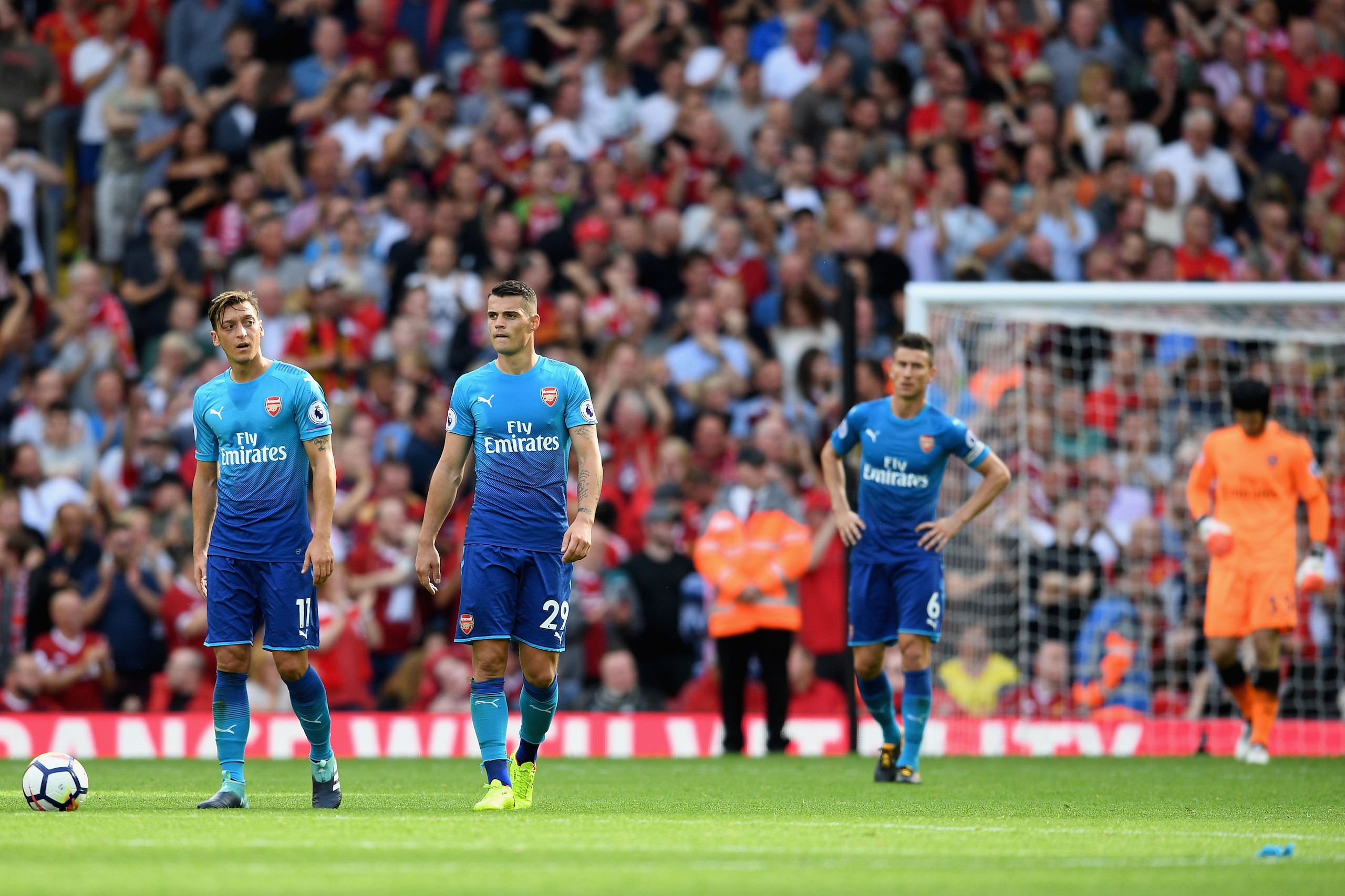 LIVERPOOL, ENGLAND - AUGUST 27:  Mesut Ozil of Arsenal are Granit Xhaka of Arsenal are dejected after Liverpool's fourth goal during the Premier League match between Liverpool and Arsenal at Anfield on August 27, 2017 in Liverpool, England.  (Photo by Mic