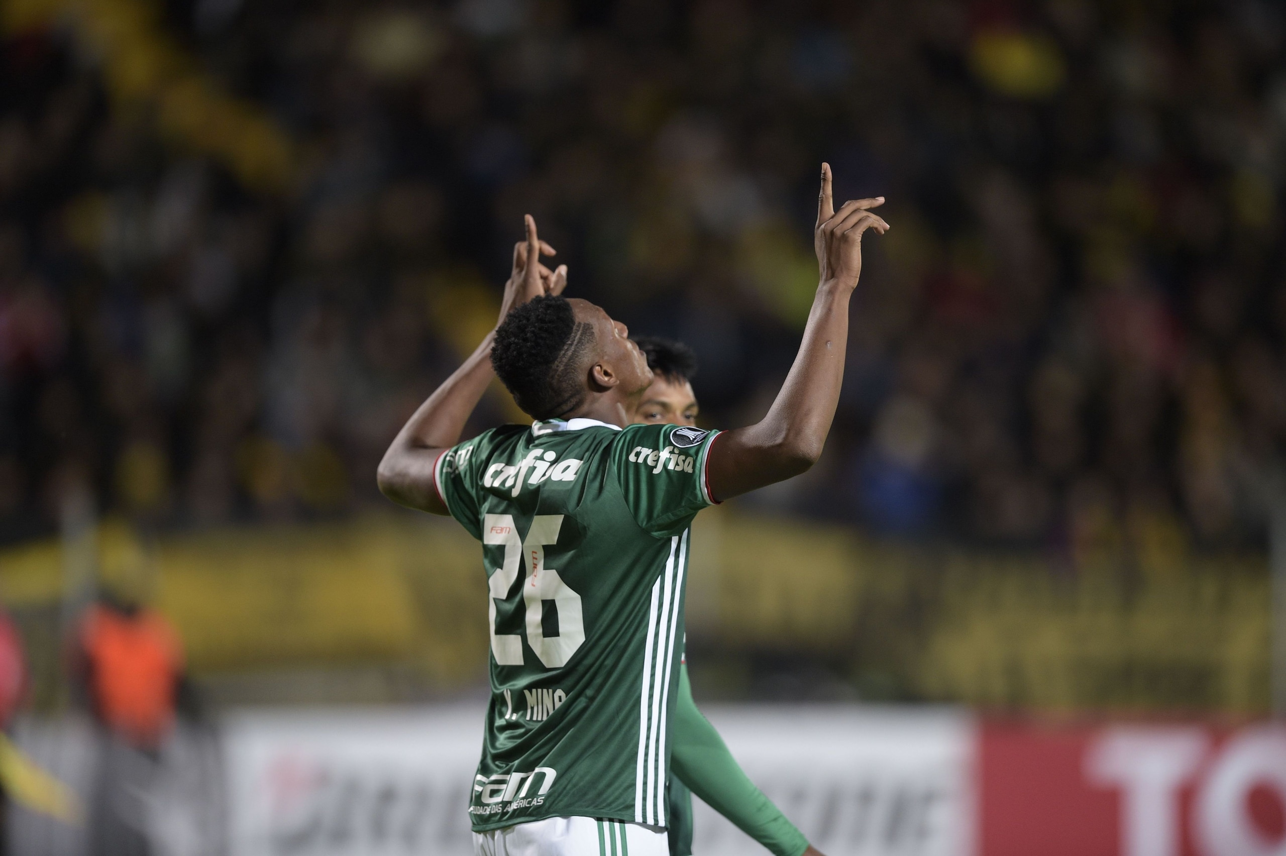 Brazil's Palmeiras player Yerry Mina celebrates after scoring a goal against Uruguay's Penarol during their Libertadores Cup football match at the Campeones del Siglo Stadium in Montevideo on April 26, 2017.  / AFP PHOTO / MIGUEL ROJO        (Photo credit