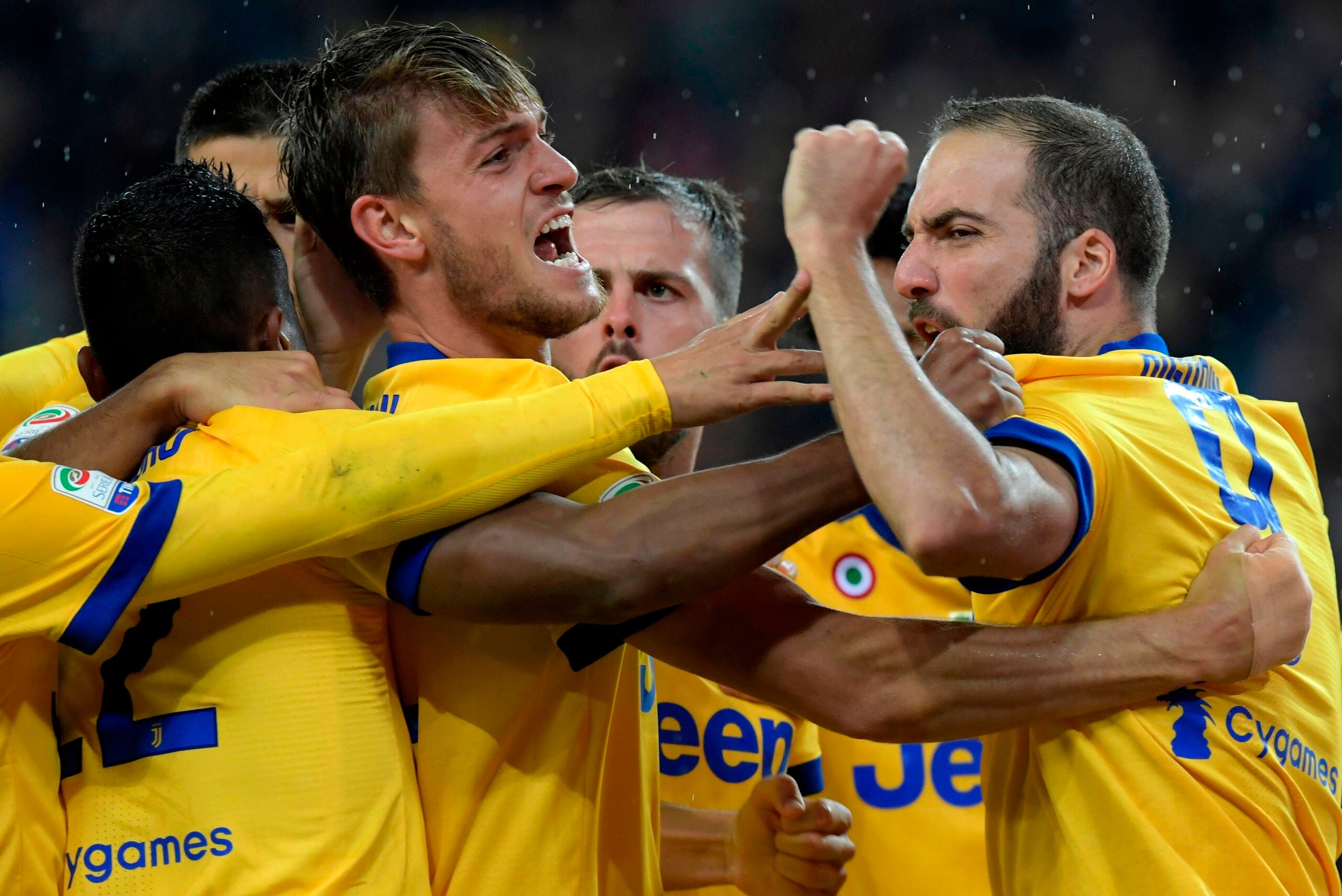 Juventus' Italian defender Daniele Rugani (2L) celebrates with teammates after scoring his team's third goal during the Italian Serie A football match Udinese vs Juventus at the Friuli stadium in Udine on October 22, 2017.  / AFP PHOTO / MIGUEL MEDINA    