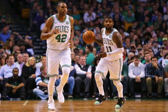 BOSTON, MA - OCTOBER 24: Kyrie Irving #11 of the Boston Celtics dribbles past Al Horford #42 during the first half against the New York Knicks at TD Garden on October 24, 2017 in Boston, Massachusetts. (Photo by Maddie Meyer/Getty Images)
