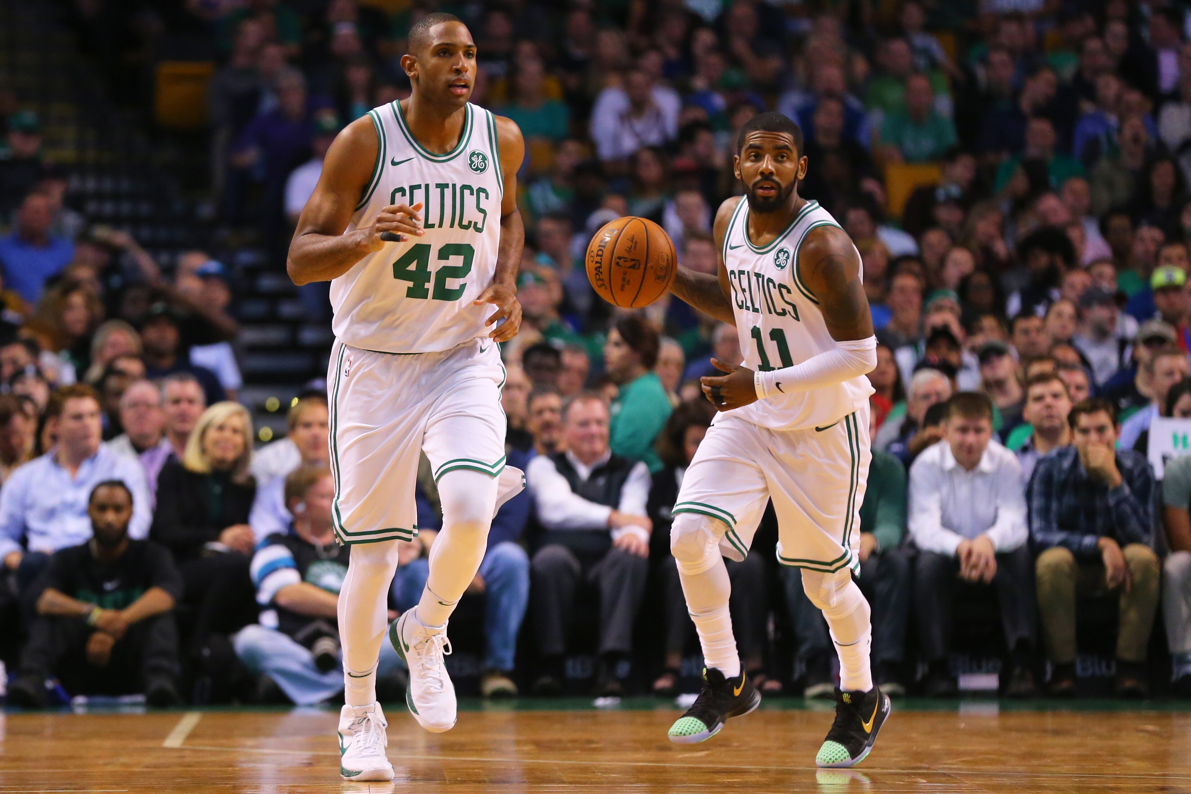 BOSTON, MA - OCTOBER 24: Kyrie Irving #11 of the Boston Celtics dribbles past Al Horford #42 during the first half against the New York Knicks at TD Garden on October 24, 2017 in Boston, Massachusetts. (Photo by Maddie Meyer/Getty Images)