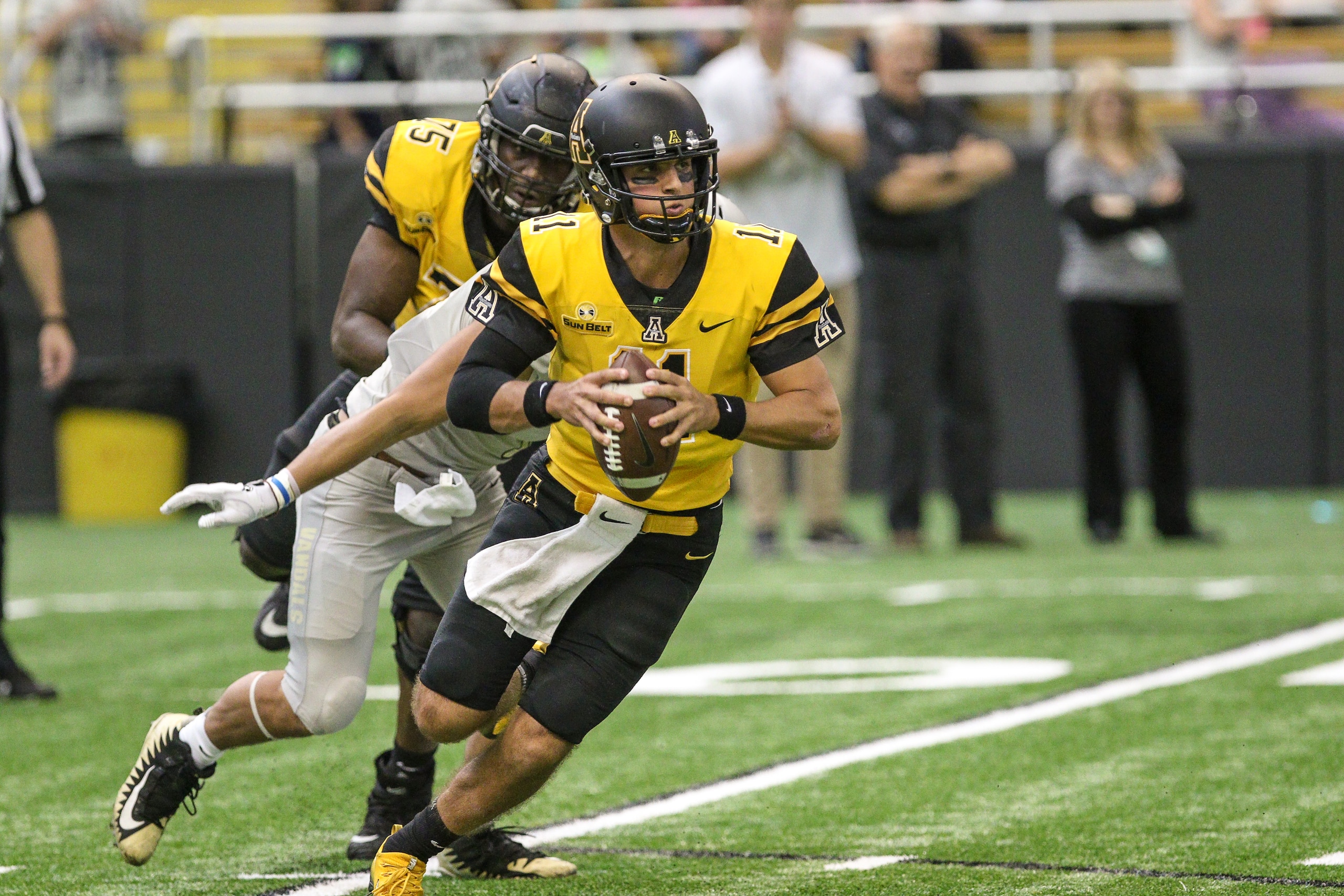 MOSCOW, ID - OCTOBER 14: Quarterback Taylor Lamb #11 of the Appalachian State Mountaineers scrambles during first half action against the Idaho Vandals on October 14, 2017 at the Kibbie Dome in Moscow, Idaho. (Photo by Loren Orr/Getty Images)