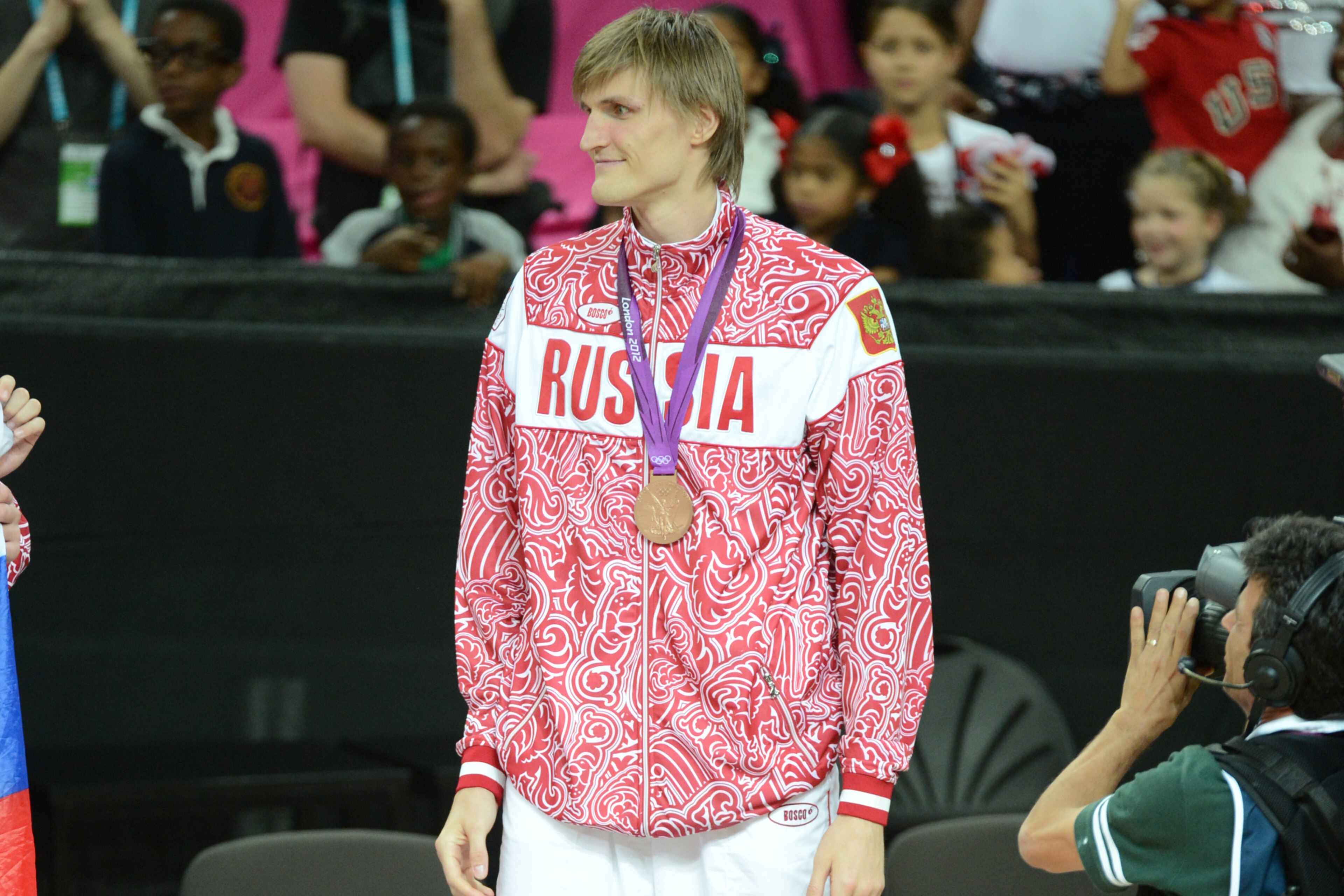 LONDON, ENGLAND - AUGUST 12: Andrei Kirilenko #15 of Russia stands on the podium with the Bronze medal after the Men's Gold Medal Basketball Game against Spain on Day 16 of the London 2012 Olympic Games at the North Greenwich Arena on August 12, 2012 in L