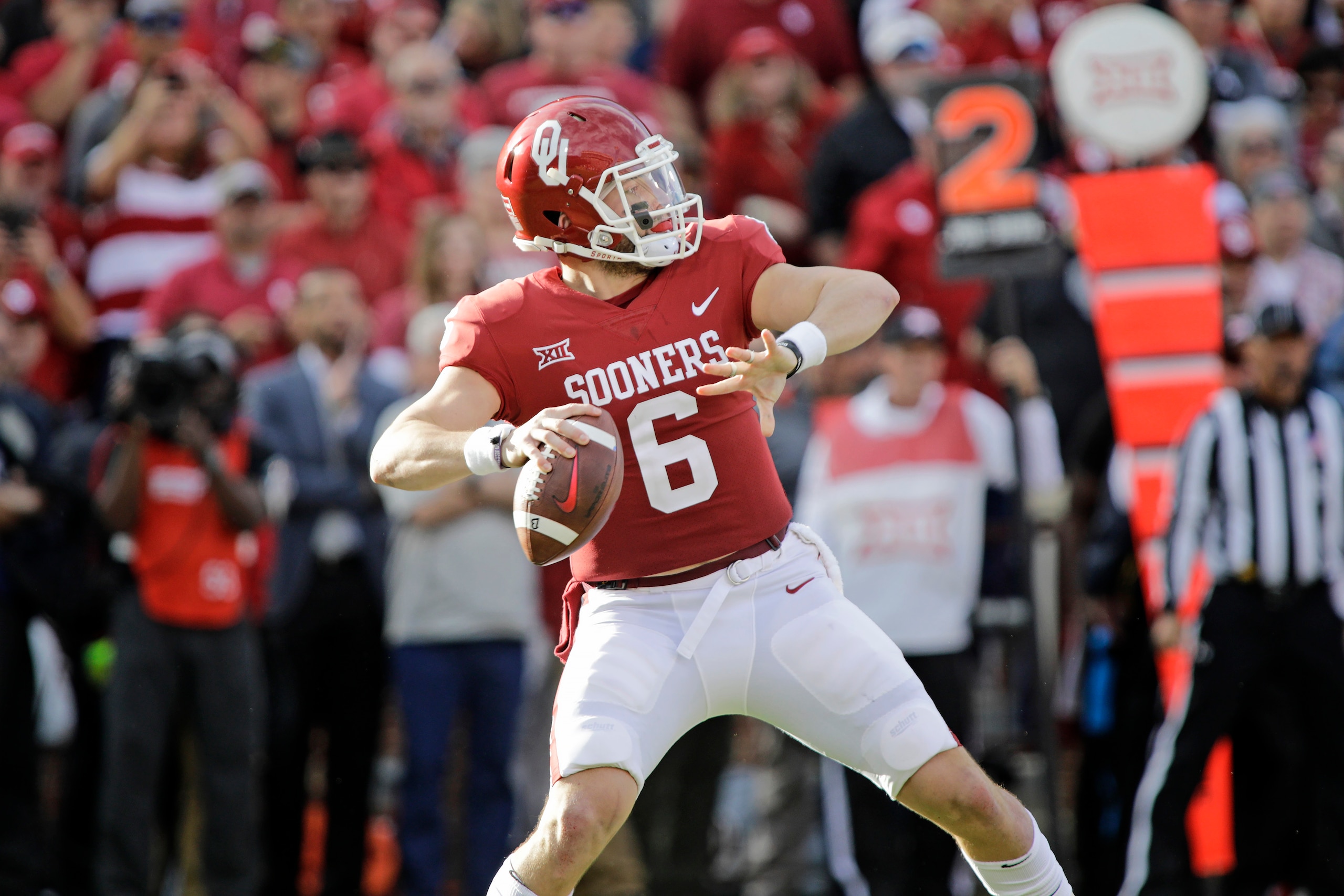 NORMAN, OK - NOVEMBER 25: Quarterback Baker Mayfield #6 of the Oklahoma Sooners looks to throw against the West Virginia Mountaineers at Gaylord Family Oklahoma Memorial Stadium on November 25, 2017 in Norman, Oklahoma. Oklahoma defeated West Virginia 59-