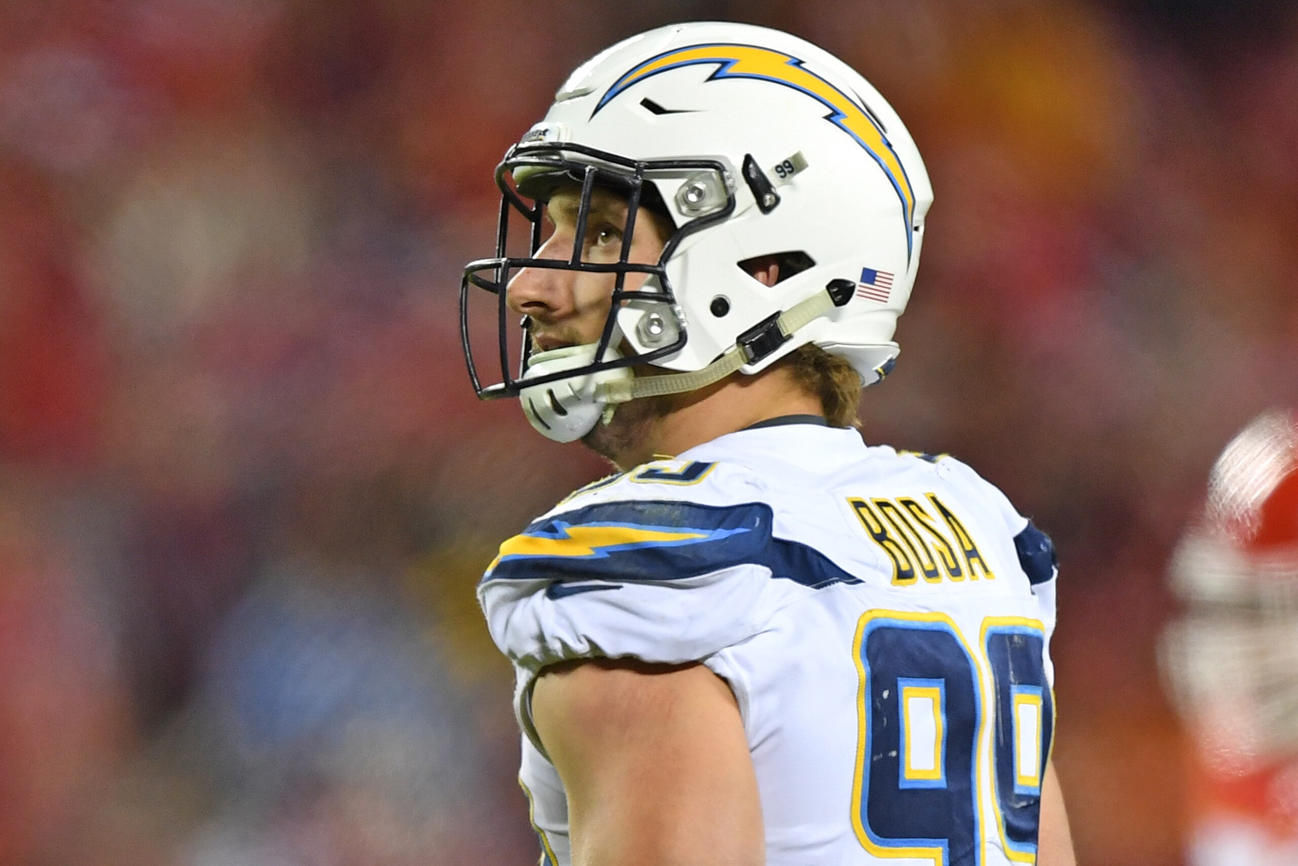 KANSAS CITY, MO - DECEMBER 16:  Defensive end Joey Bosa #99 of the Los Angeles Chargers looks on against the Kansas City Chiefs during the second half at Arrowhead Stadium on December 16, 2017 in Kansas City, Missouri.  (Photo by Peter G. Aiken/Getty Imag