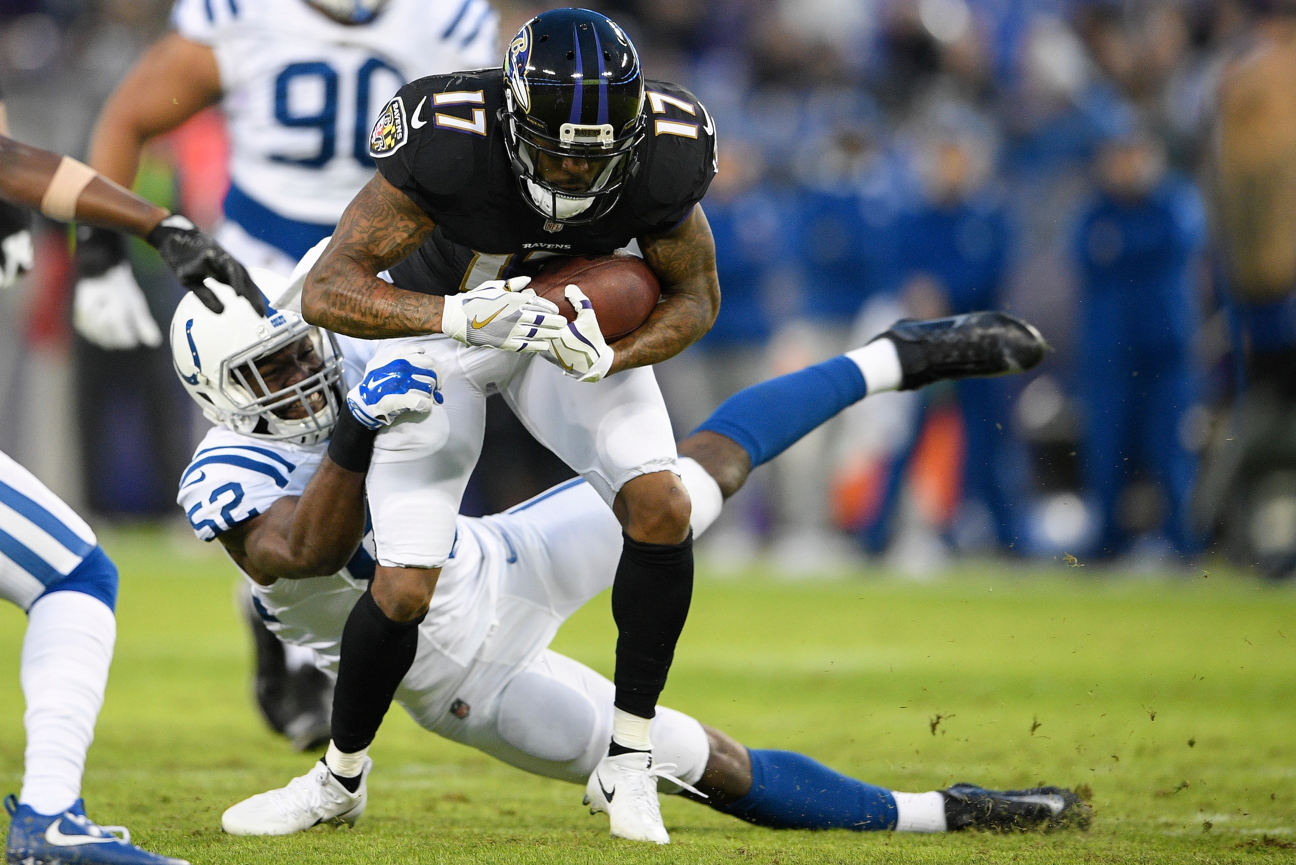Baltimore Ravens wide receiver Mike Wallace makes a catch against Indianapolis Colts linebacker Barkevious Mingo.