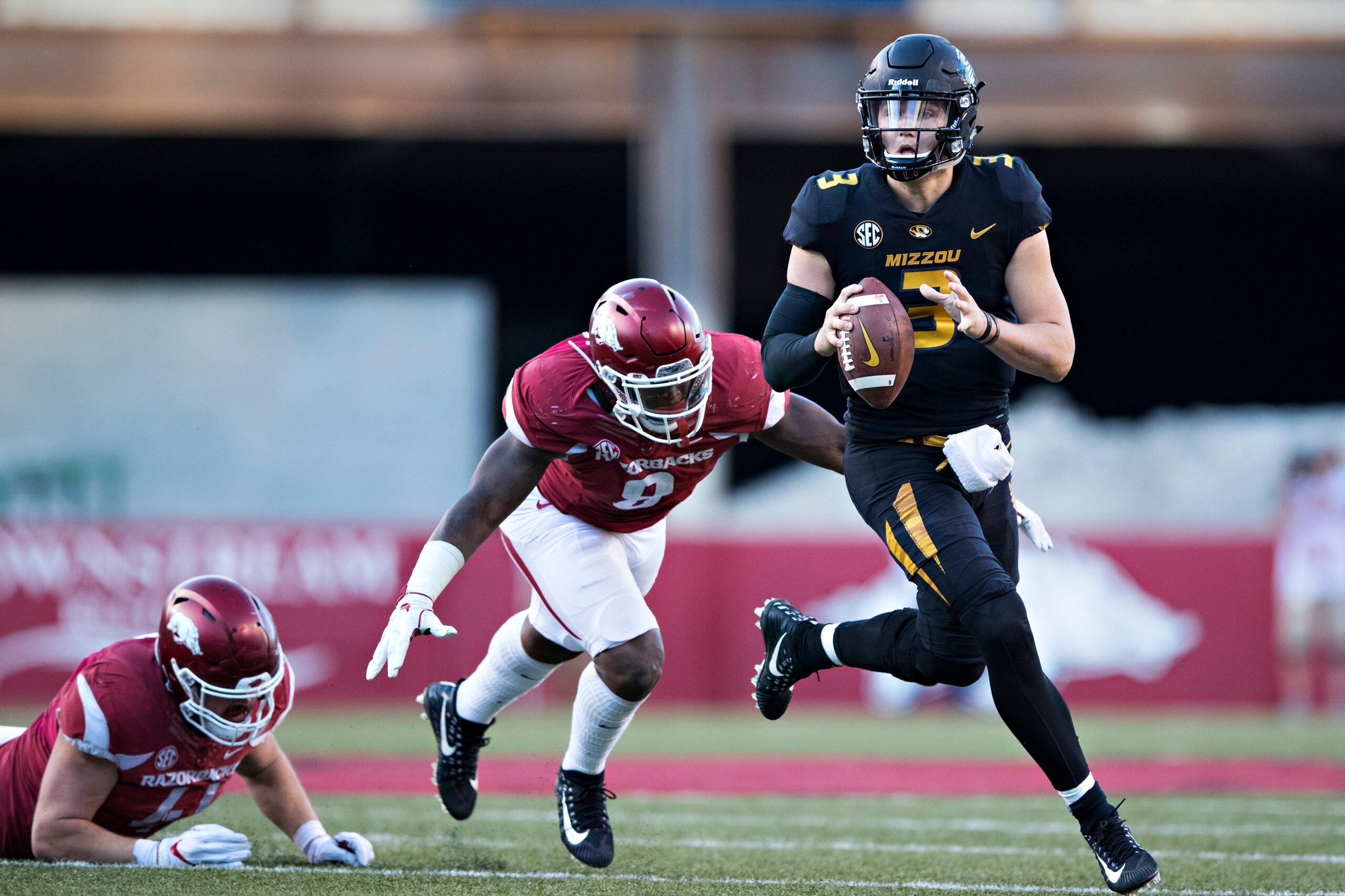 FAYETTEVILLE, AR - NOVEMBER 24:  Drew Lock #3 of the Missouri Tigers runs the ball during a game against the Arkansas Razorbacks at Razorback Stadium on November 24, 2017 in Fayetteville, Arkansas.  The Tigers defeated the Razorbacks 48-45.  (Photo by Wes