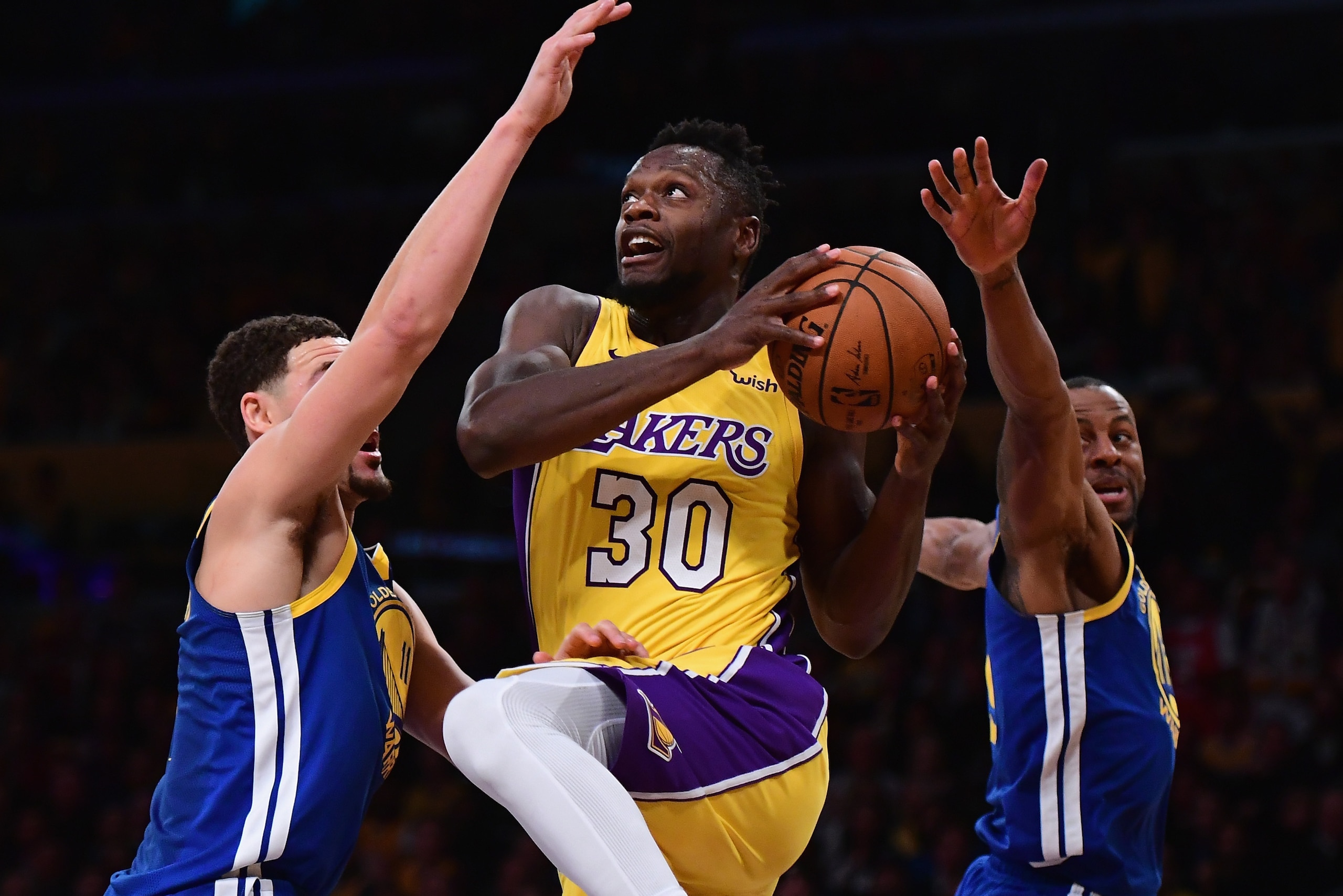 LOS ANGELES, CA - DECEMBER 18: Julius Randle #30 of the Los Angeles Lakers drives between Klay Thompson #11 and Andre Iguodala #9 during a 116-114 Warrior overtime win at Staples Center on December 18, 2017 in Los Angeles, California. (Photo by Harry Ho LOS ANGELES, CA - DECEMBER 18: Julius Randle #30 of the Los Angeles Lakers drives between Klay Thompson #11 and Andre Iguodala #9 during a 116-114 Warrior overtime win at Staples Center on December 18, 2017 in Los Angeles, California. (Photo by Harry Ho