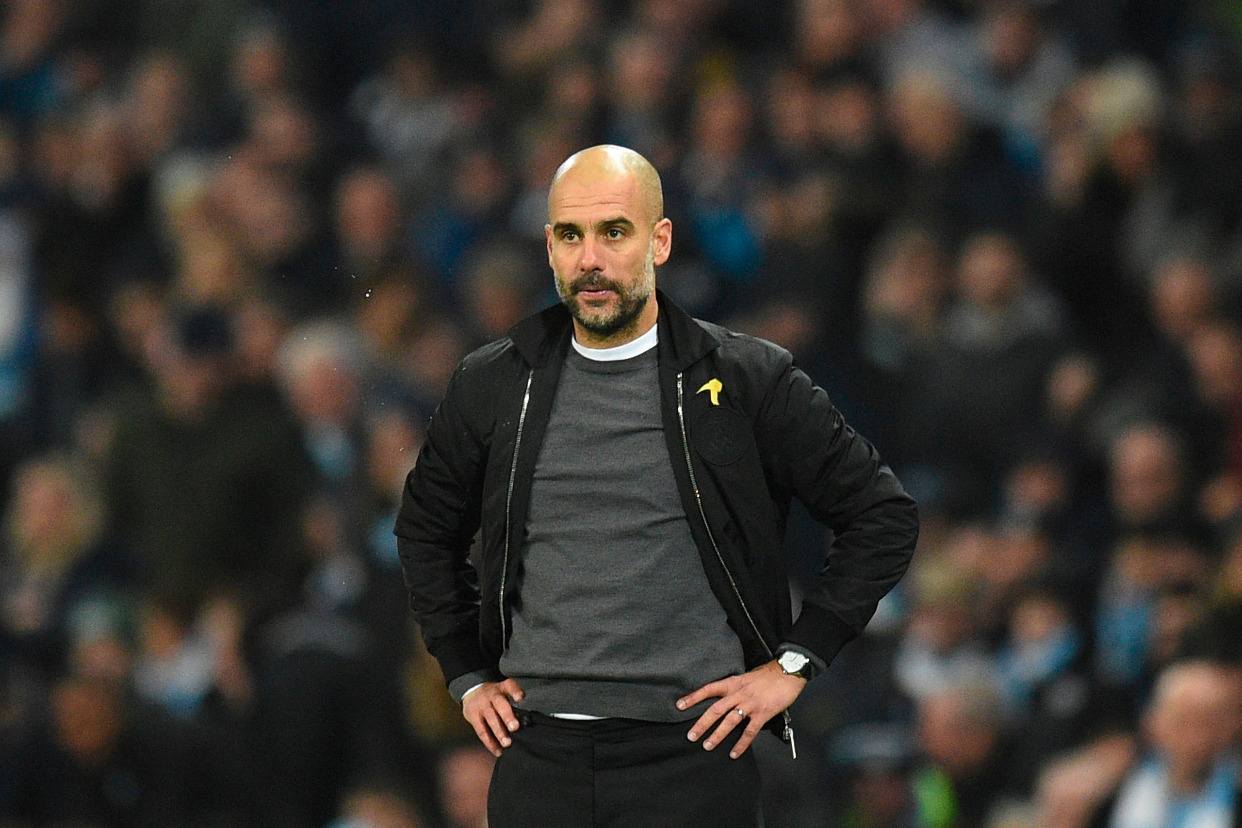 Manchester City's Spanish manager Pep Guardiola watches from the touchline during the English Premier League football match between Manchester City and Bournemouth at the Etihad Stadium in Manchester, north west England, on December 23, 2017. / AFP PHOTO Manchester City's Spanish manager Pep Guardiola watches from the touchline during the English Premier League football match between Manchester City and Bournemouth at the Etihad Stadium in Manchester, north west England, on December 23, 2017. / AFP PHOTO