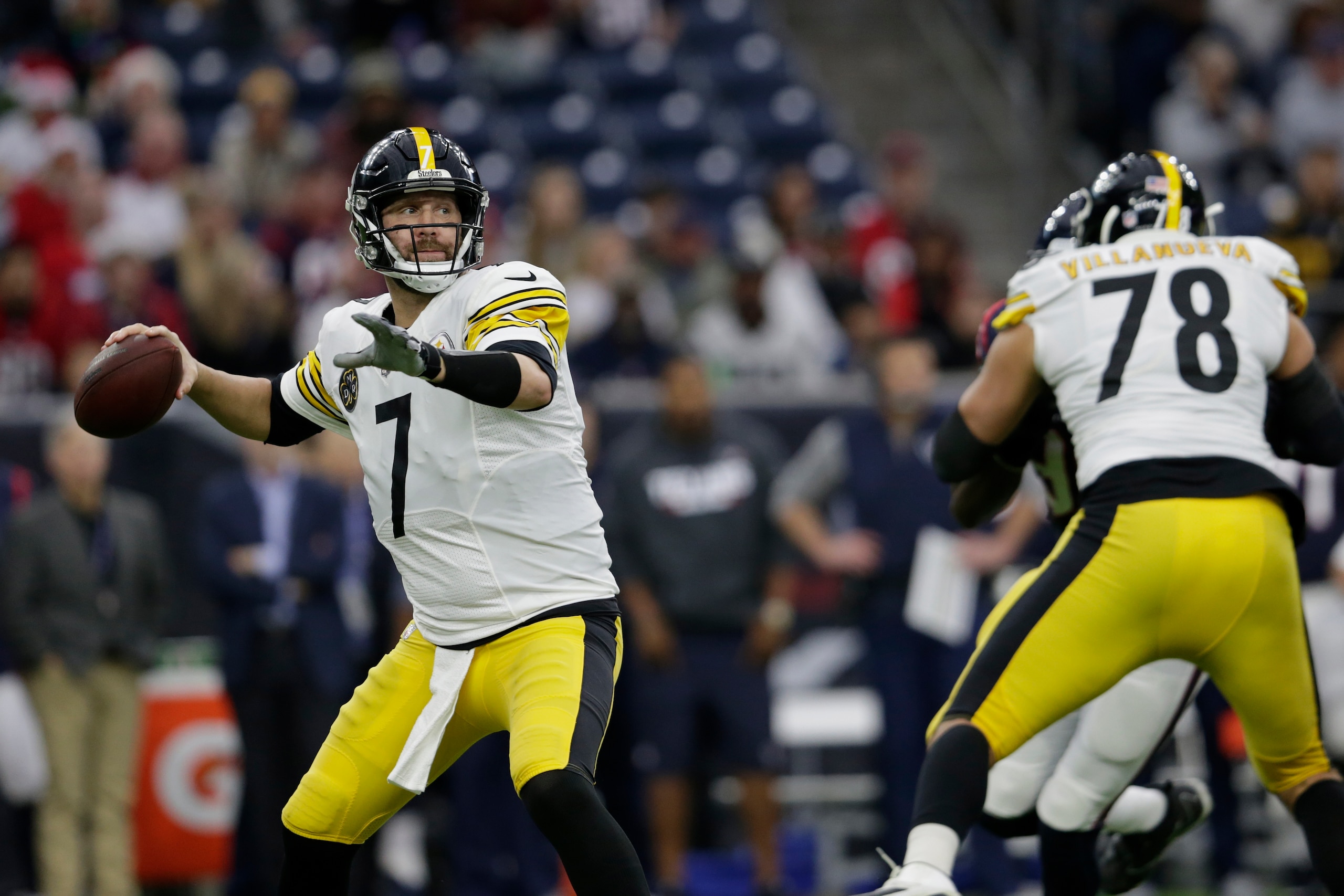 HOUSTON, TX - DECEMBER 25:  Ben Roethlisberger #7 of the Pittsburgh Steelers looks to pass in the first quarter as Alejandro Villanueva #78 blocks Jadeveon Clowney #90 of the Houston Texans at NRG Stadium on December 25, 2017 in Houston, Texas.  (Photo by
