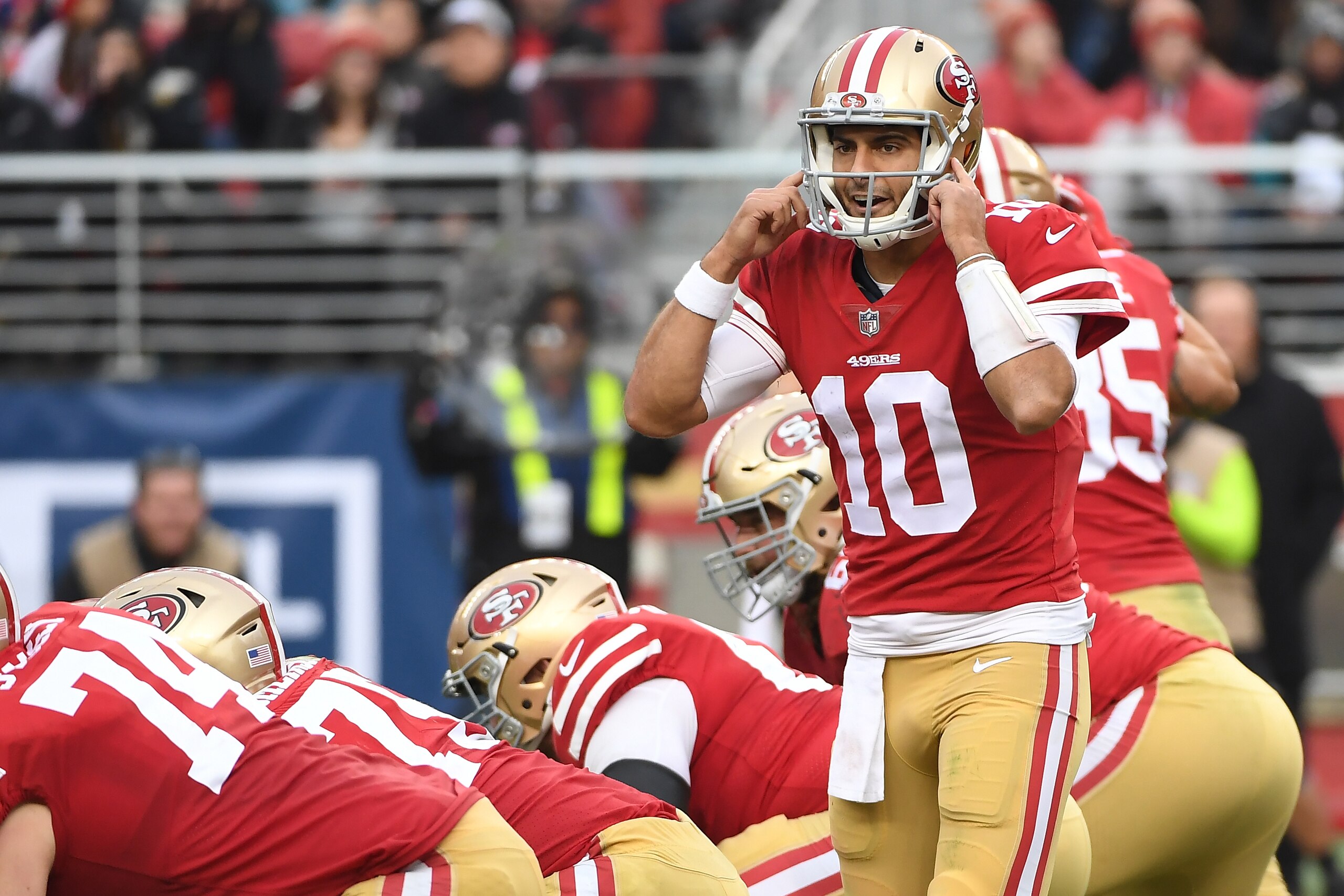 SANTA CLARA, CA - DECEMBER 24:  Jimmy Garoppolo #10 of the San Francisco 49ers signalsto his team during their NFL game against the Jacksonville Jaguars at Levi's Stadium on December 24, 2017 in Santa Clara, California.  (Photo by Robert Reiners/Getty Ima