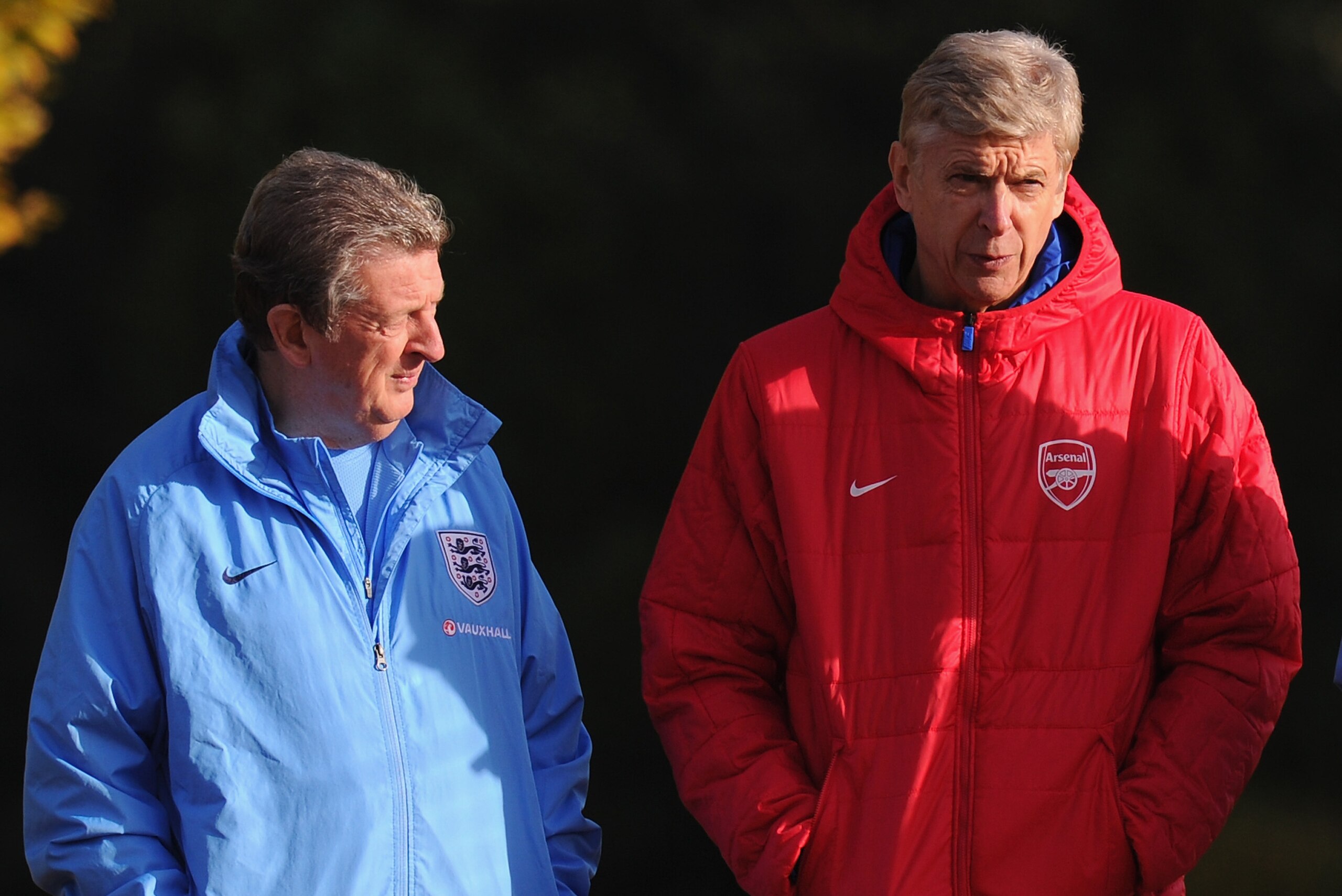 ST ALBANS, ENGLAND - NOVEMBER 13:  England manager Roy Hodgson chats with Arsenal manager Arsene Wenger during an England Training Session at London Colney on November 13, 2013 in St Albans, England.  (Photo by Mike Hewitt/Getty Images)