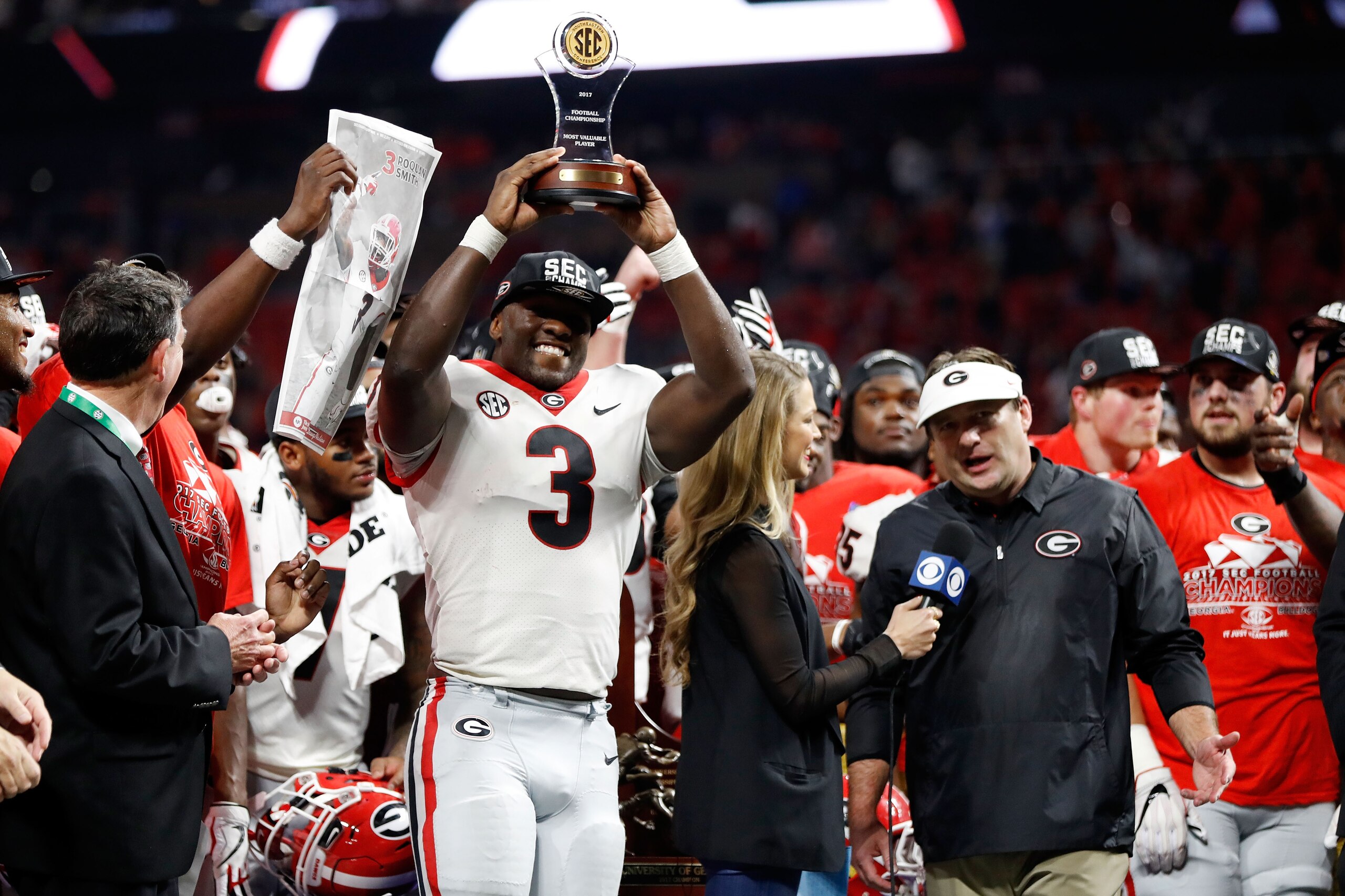ATLANTA, GA - DECEMBER 02: Roquan Smith #3 of the Georgia Bulldogs reacts to winning the game MVP trophy after beating the Auburn Tigers in the SEC Championship at Mercedes-Benz Stadium on December 2, 2017 in Atlanta, Georgia. (Photo by Jamie Squire/Getty