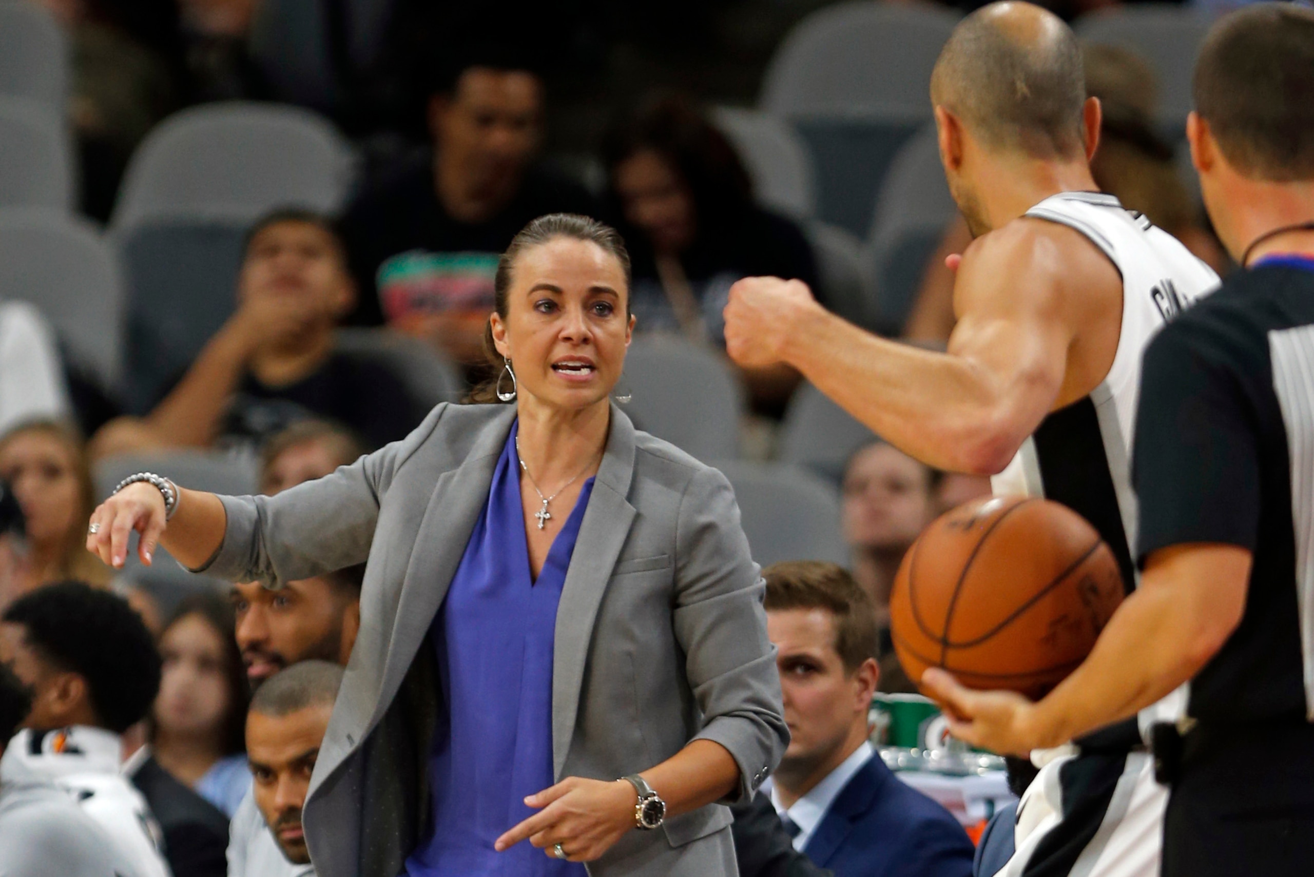 SAN ANTONIO,TX - OCTOBER 8: Filling in for head coach Gregg Popovich, Becky Hammon talks to Manu Ginobili #20 of the San Antonio Spurs during game against the Denver Nuggets at AT&T Center on October 8, 2017 in San Antonio, Texas. NOTE TO USER: User expre SAN ANTONIO,TX - OCTOBER 8: Filling in for head coach Gregg Popovich, Becky Hammon talks to Manu Ginobili #20 of the San Antonio Spurs during game against the Denver Nuggets at AT&T Center on October 8, 2017 in San Antonio, Texas. NOTE TO USER: User expre