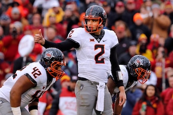 AMES, IA - NOVEMBER 11: Quarterback Mason Rudolph #2 of the Oklahoma State Cowboys signals a play at the line of scrimmage in the first half of play against the Iowa State Cyclones at Jack Trice Stadium on November 11, 2017 in Ames, Iowa. The Oklahoma Sta