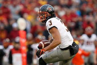 AMES, IA - NOVEMBER 11: Wide receiver Marcell Ateman #3 of the Oklahoma State Cowboys rushes for yards in the second half of play against the Iowa State Cyclones at Jack Trice Stadium on November 11, 2017 in Ames, Iowa. The Oklahoma State Cowboys won 49-4